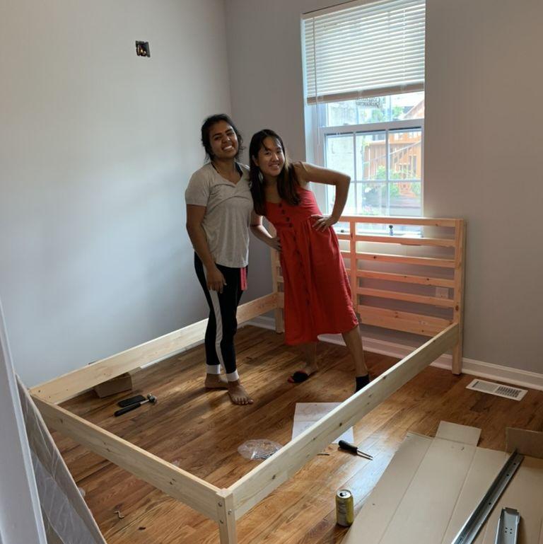 Azmina (bridesmaid) and Juliana's first picture together -- where she built Juliana's bed and saved the day!