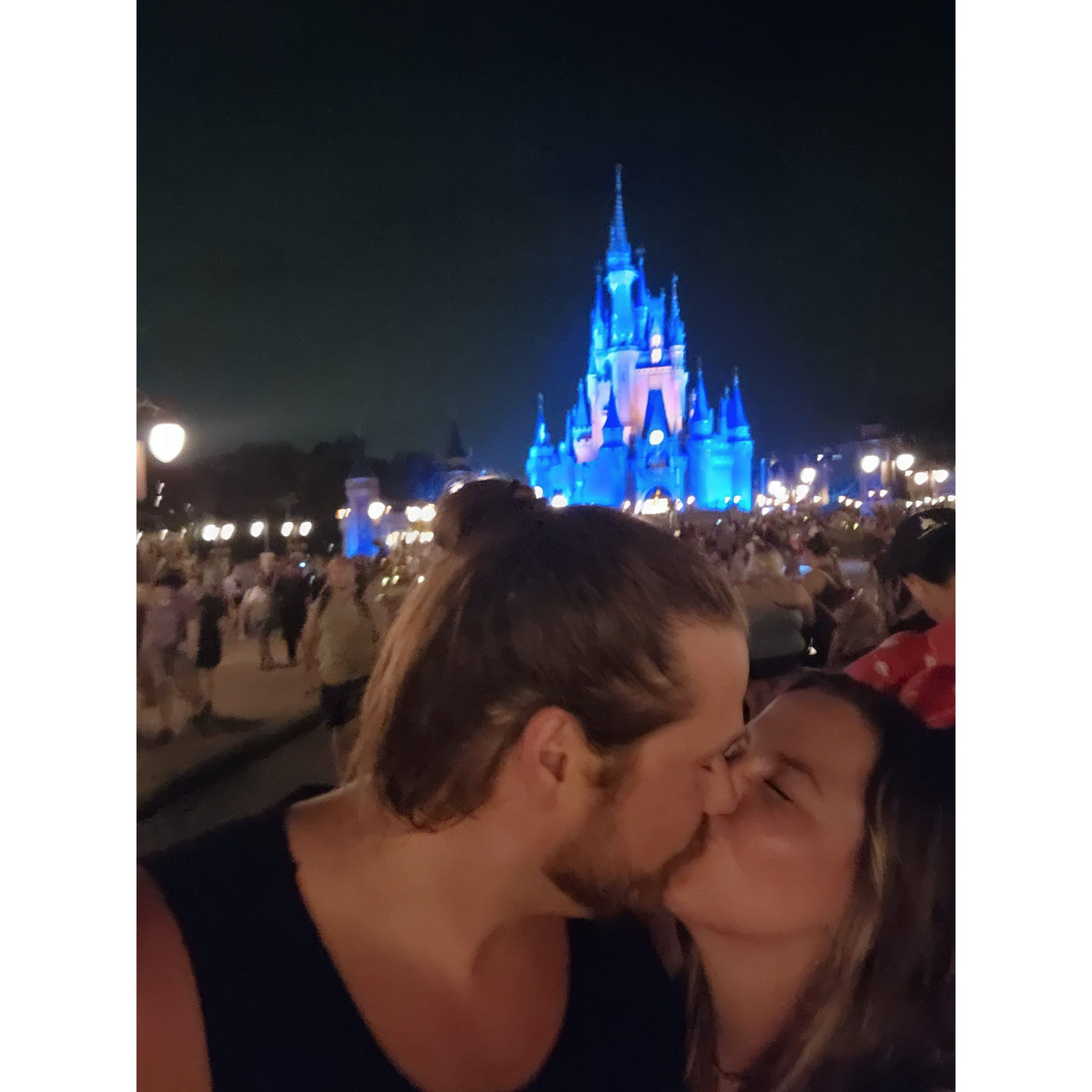 Kissing in front of the castle after Wilding's first ever Disney day!