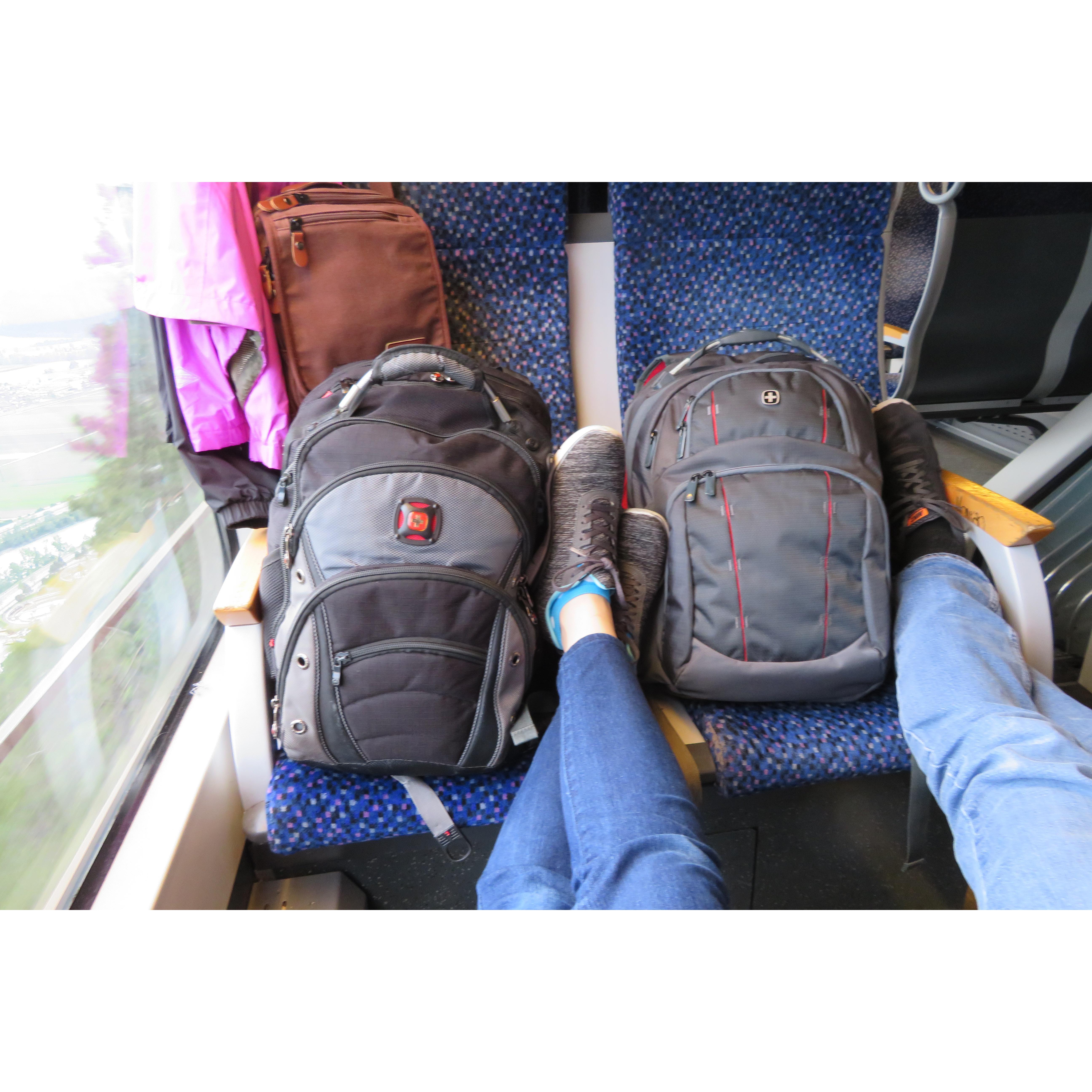 May 20, 2019: Twin backpacks and crossed legs on the OEBB train!