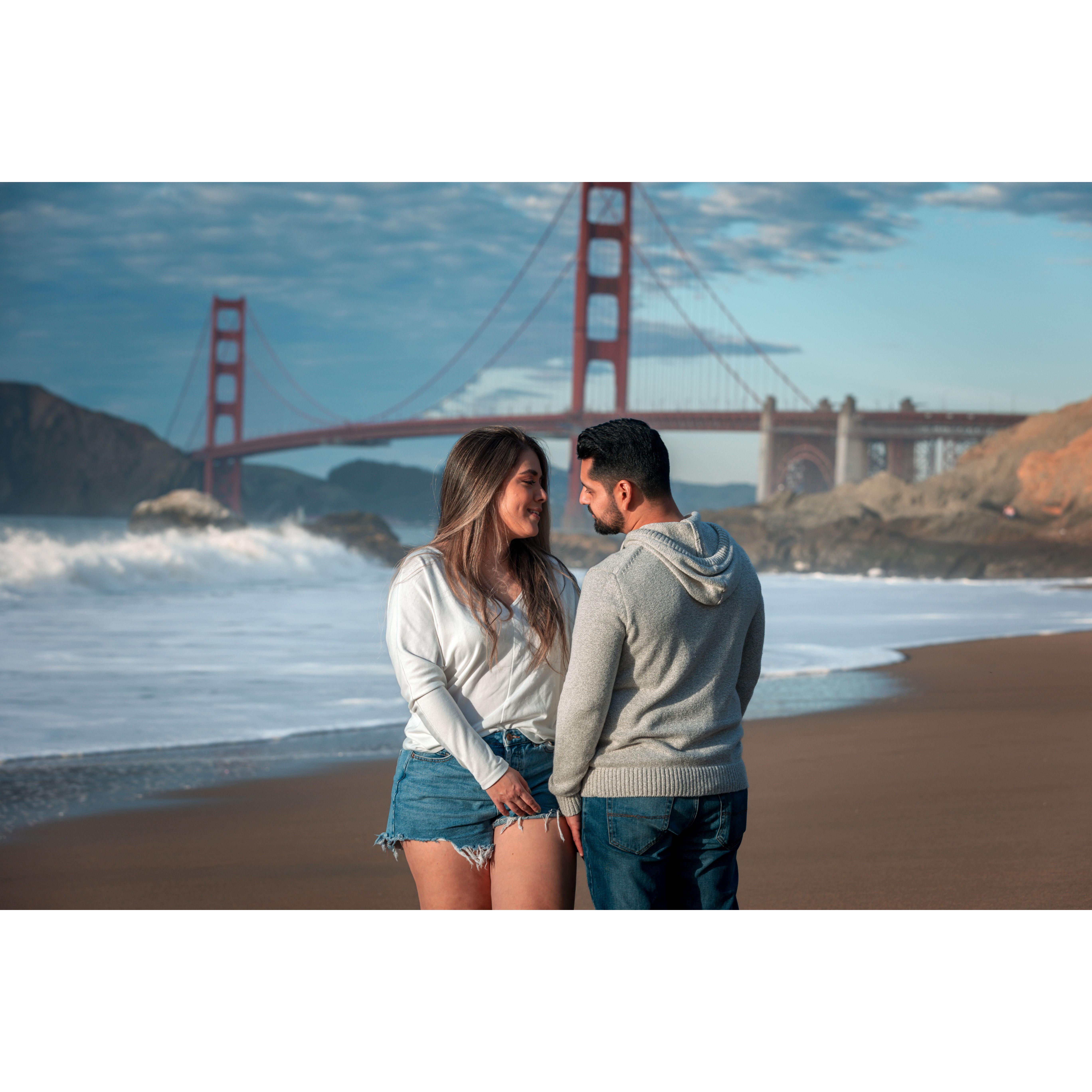 Flirting by the shore, love in the Golden Gate glow. 💘🌅 #BeachRomance #GoldenGateMagic
