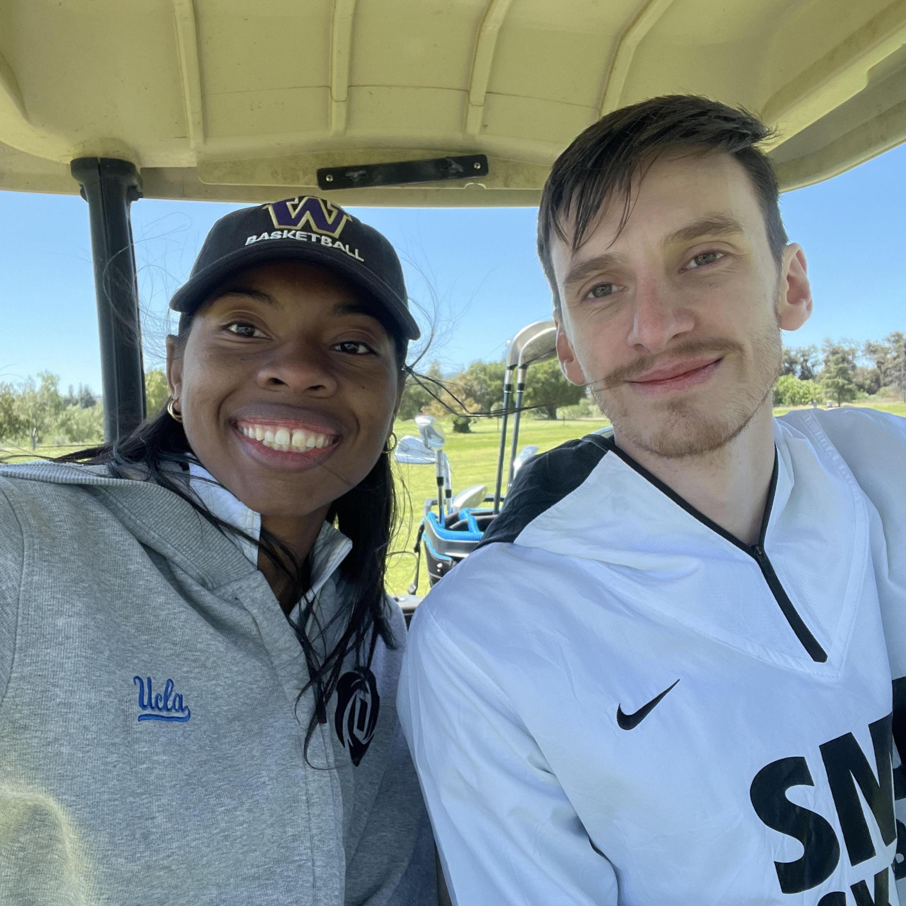 Chance teaching Jewelyn how to play golf!
