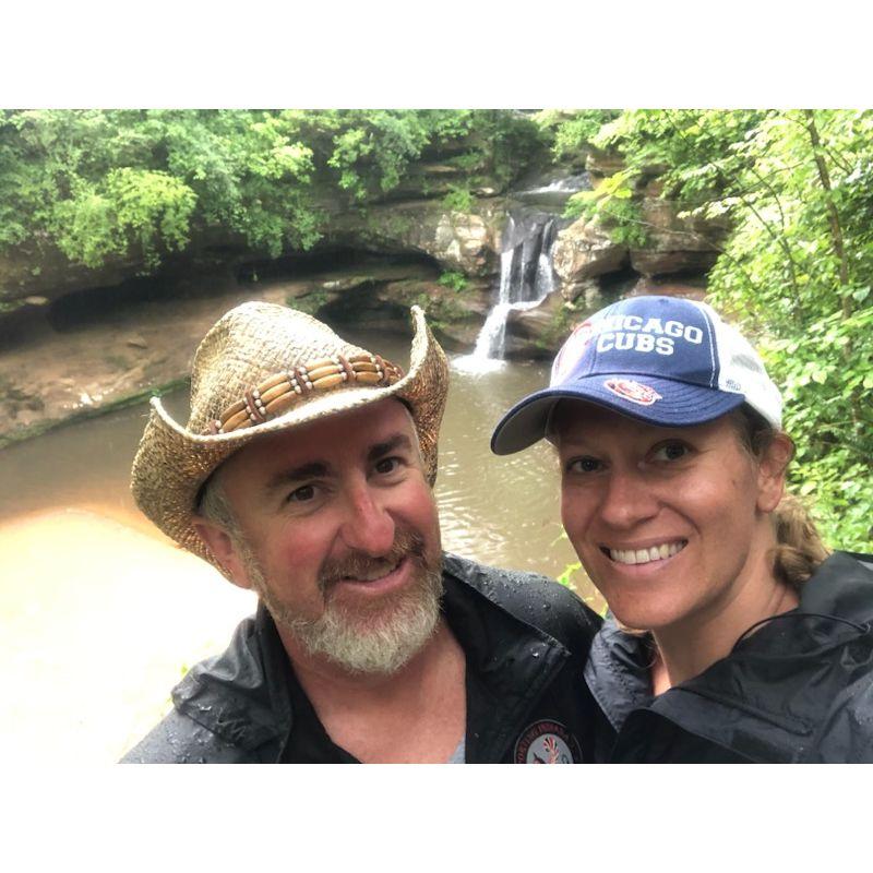 Hocking Hills hiking a trail in the rain. She loves the hat.