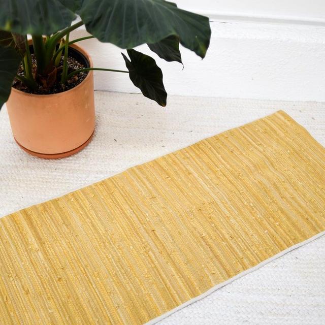 handwoven recycled rug with edging - golden hues