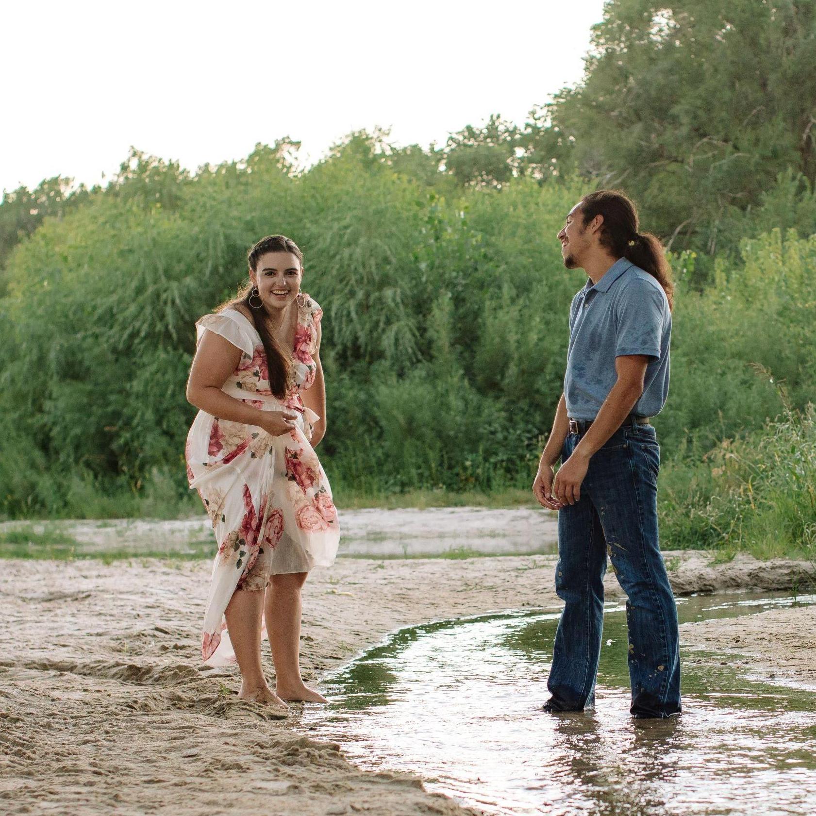 (Engagement Photo) As we were playing in the water, Rebecca accidentally kicked some mud at John Michael. Oops!