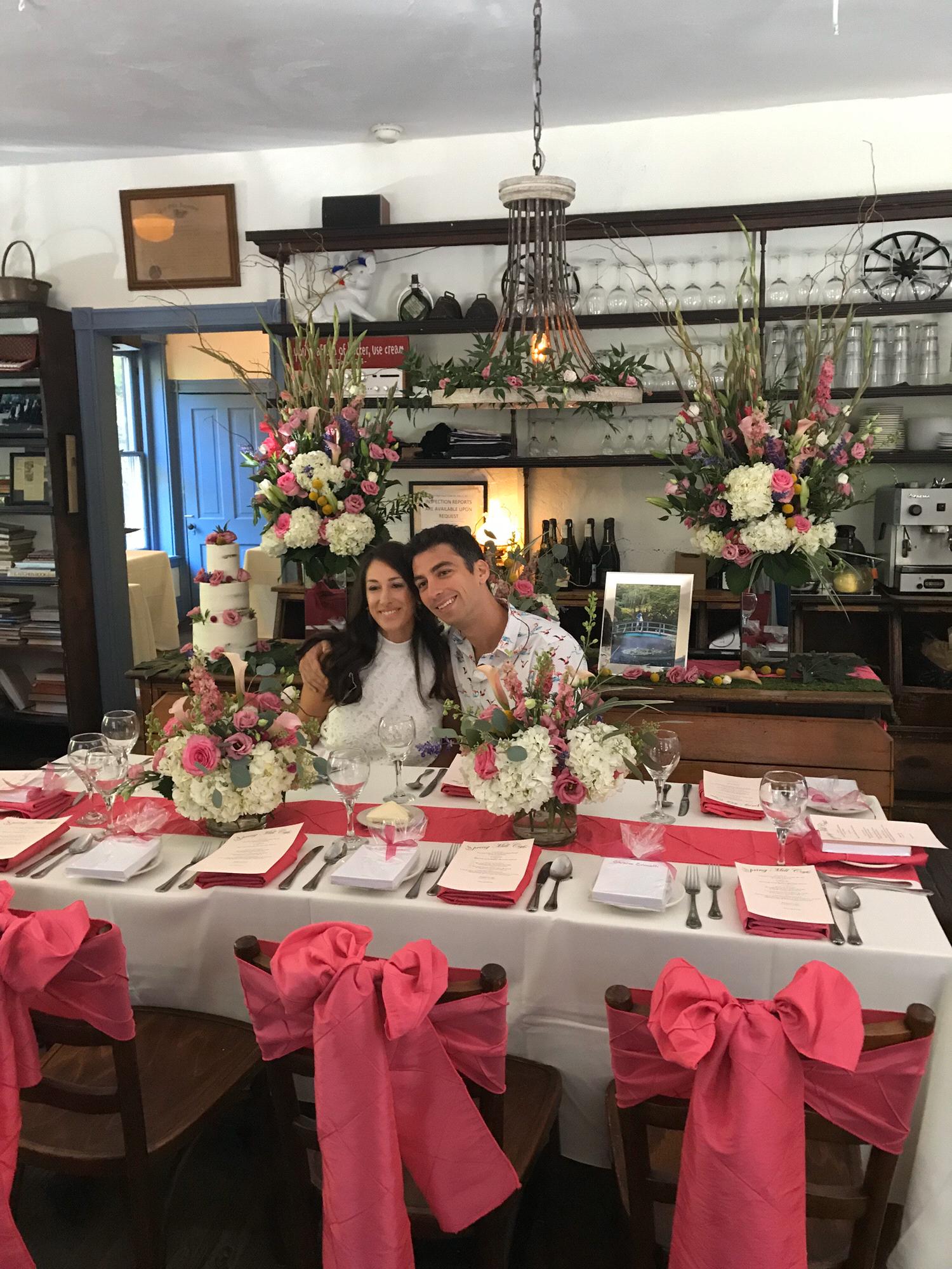 Surrounded by friends and flowers at my bridal shower at Spring Mill Cafe