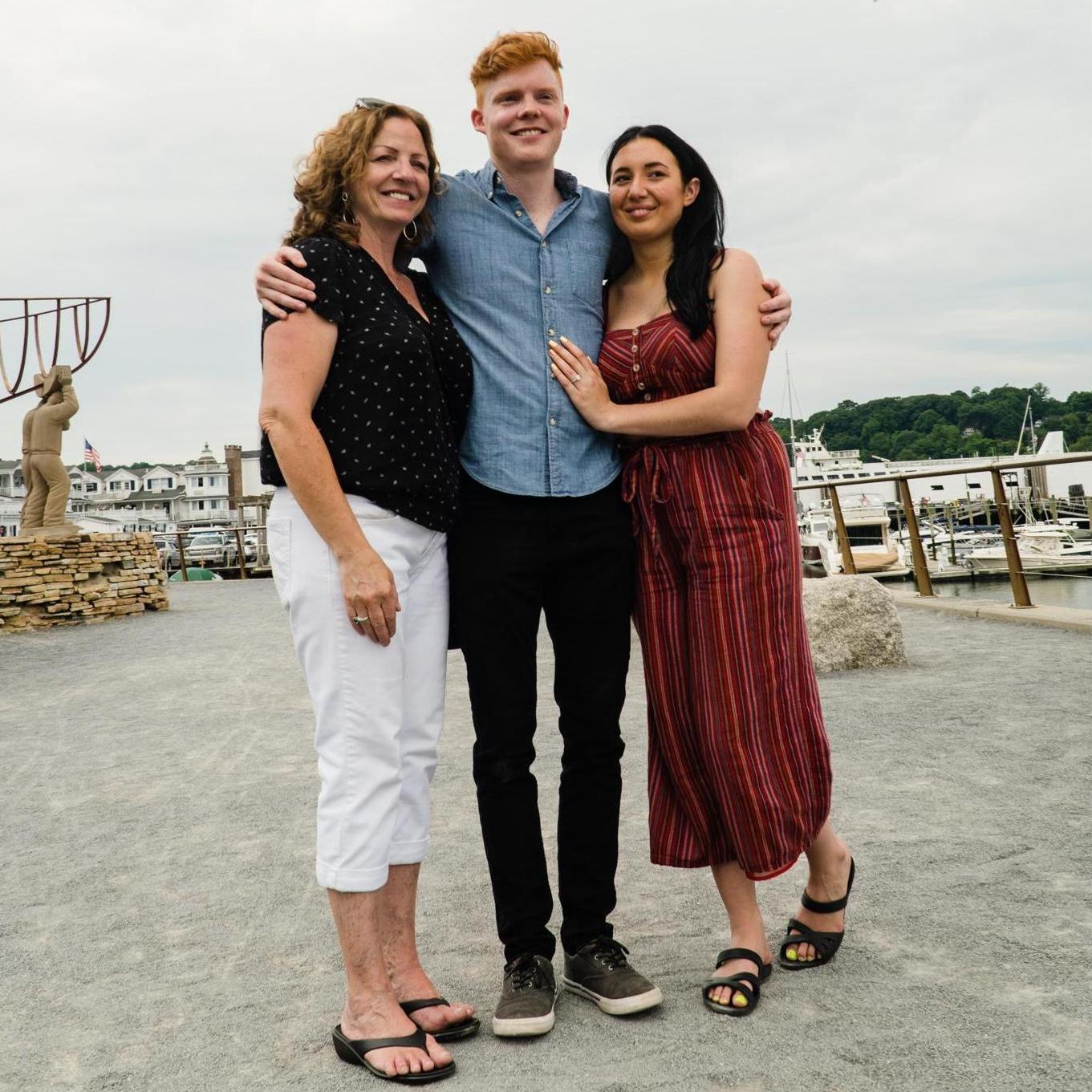 Mother of the Groom with the couple on the day of the engagement surprise.