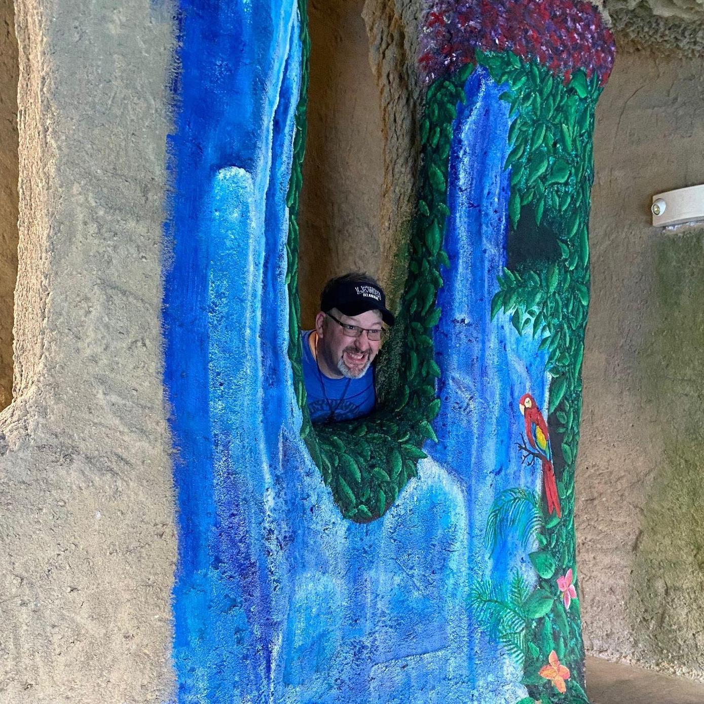 Tom having fun in a cave on the mini golf course while at the beach!
