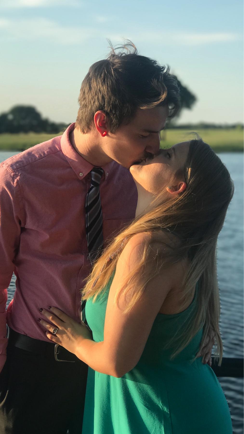 At another one of our friends weddings and stealing a kiss!