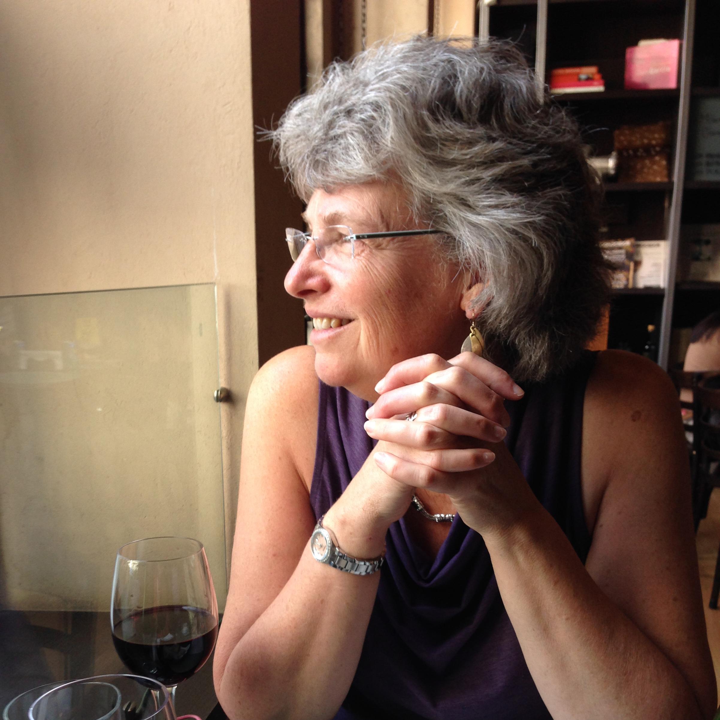 Jan gazes out the window of a café in Buenos Aires in 2013 — our first trip together! (Brave woman!)