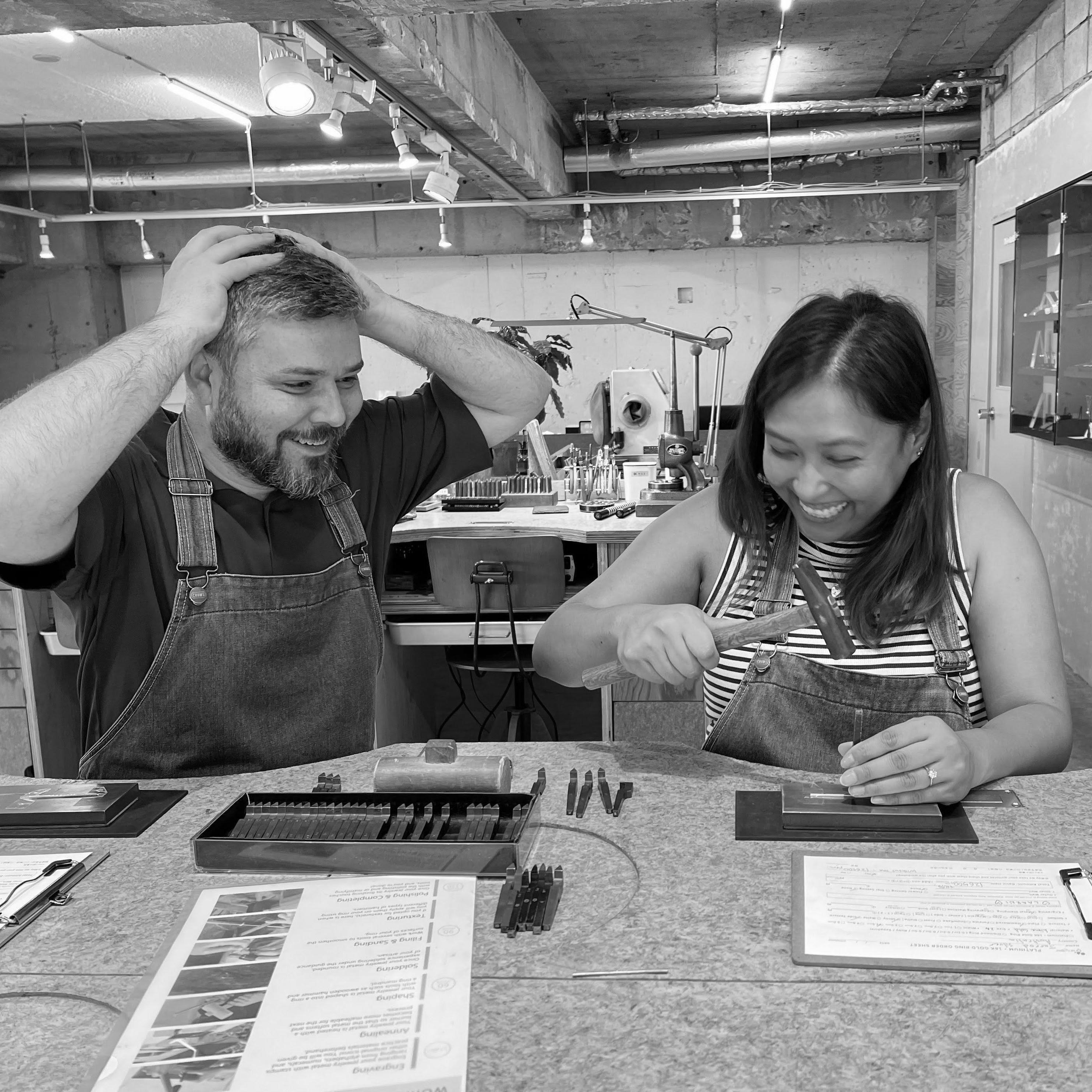 We made each other's wedding rings in Japan.

Here's Jarrod watching Laarni engraving his ring in a *unique* way. 💍