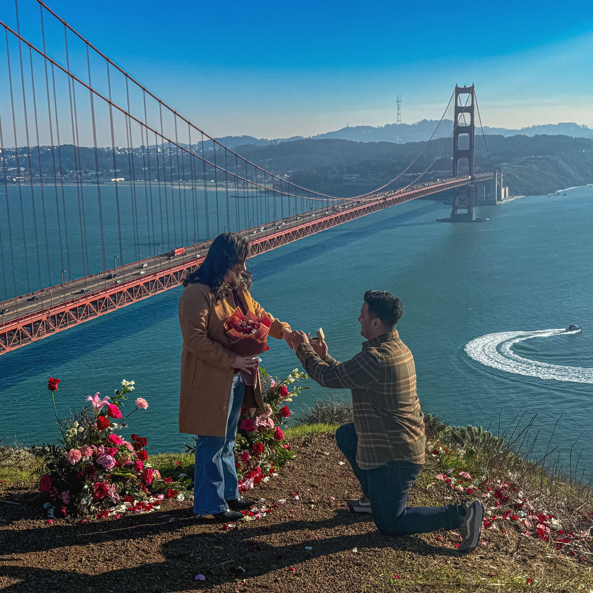Kevin proposing on November 26, 2025 by the San Francisco Golden Gate Bridge.