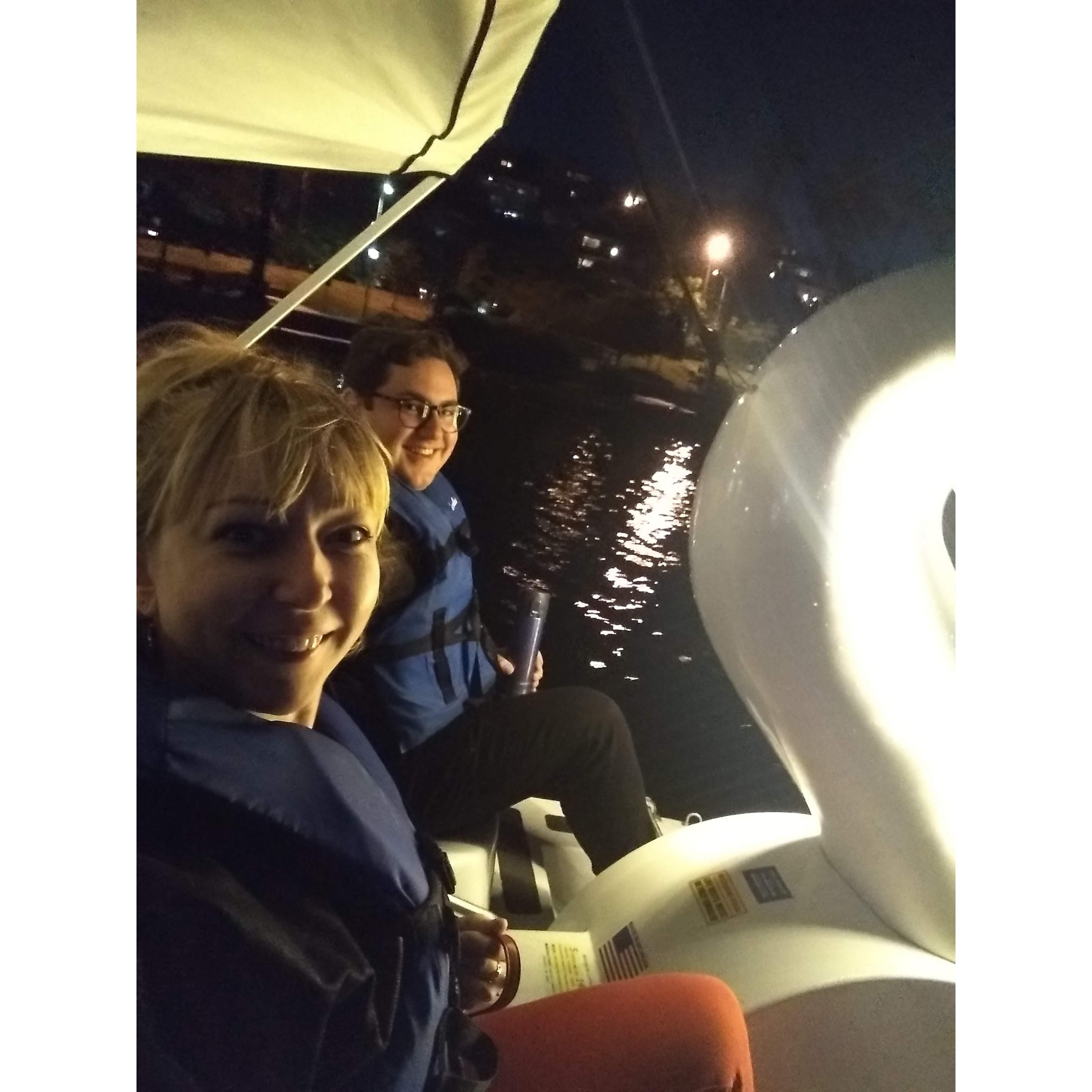 Night ride on a white swan in Echo Park. Shiny lake and a beautiful full moon.