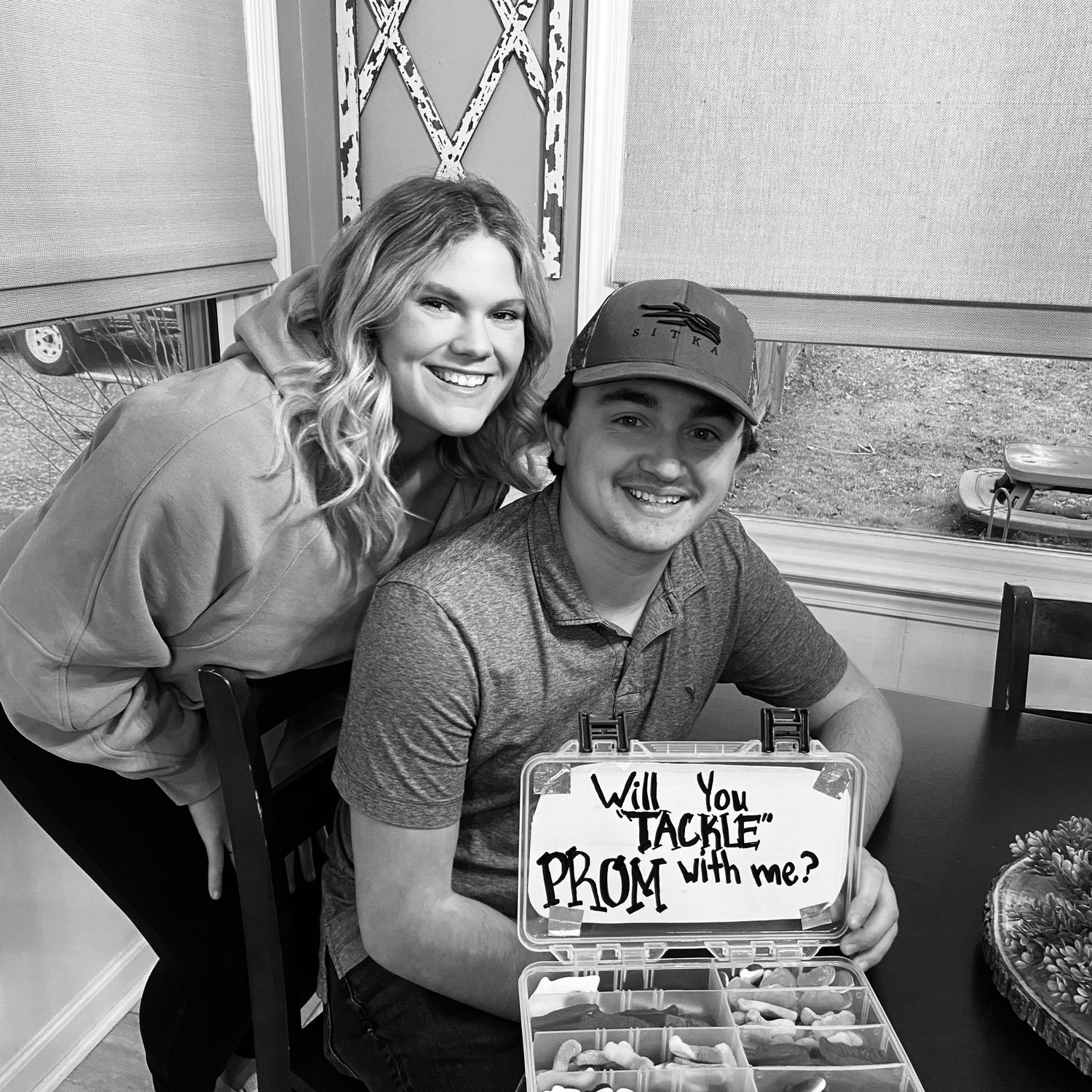 Senior promposal that said "will you "TACKLE" prom with me?"