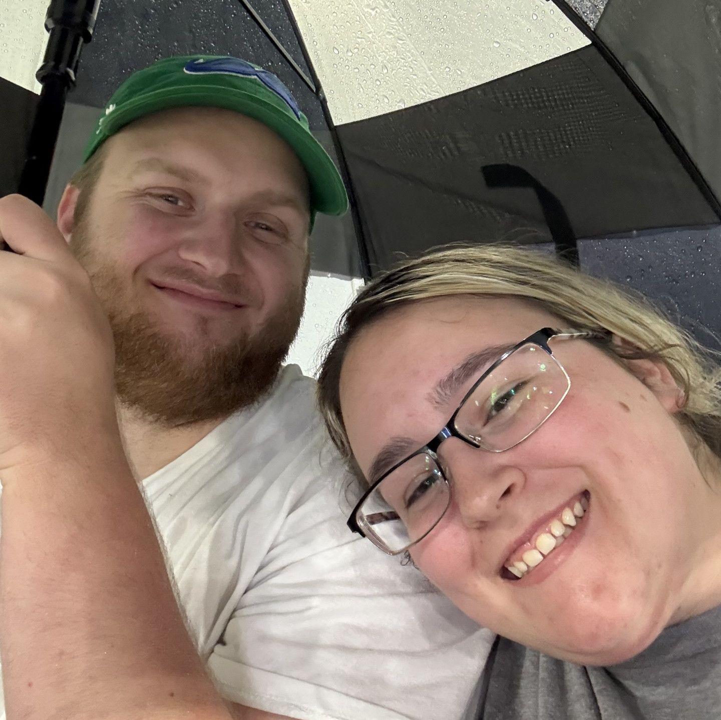 We love baseball games, even in the POURING rain! We were the only ones still sitting out in the stands.