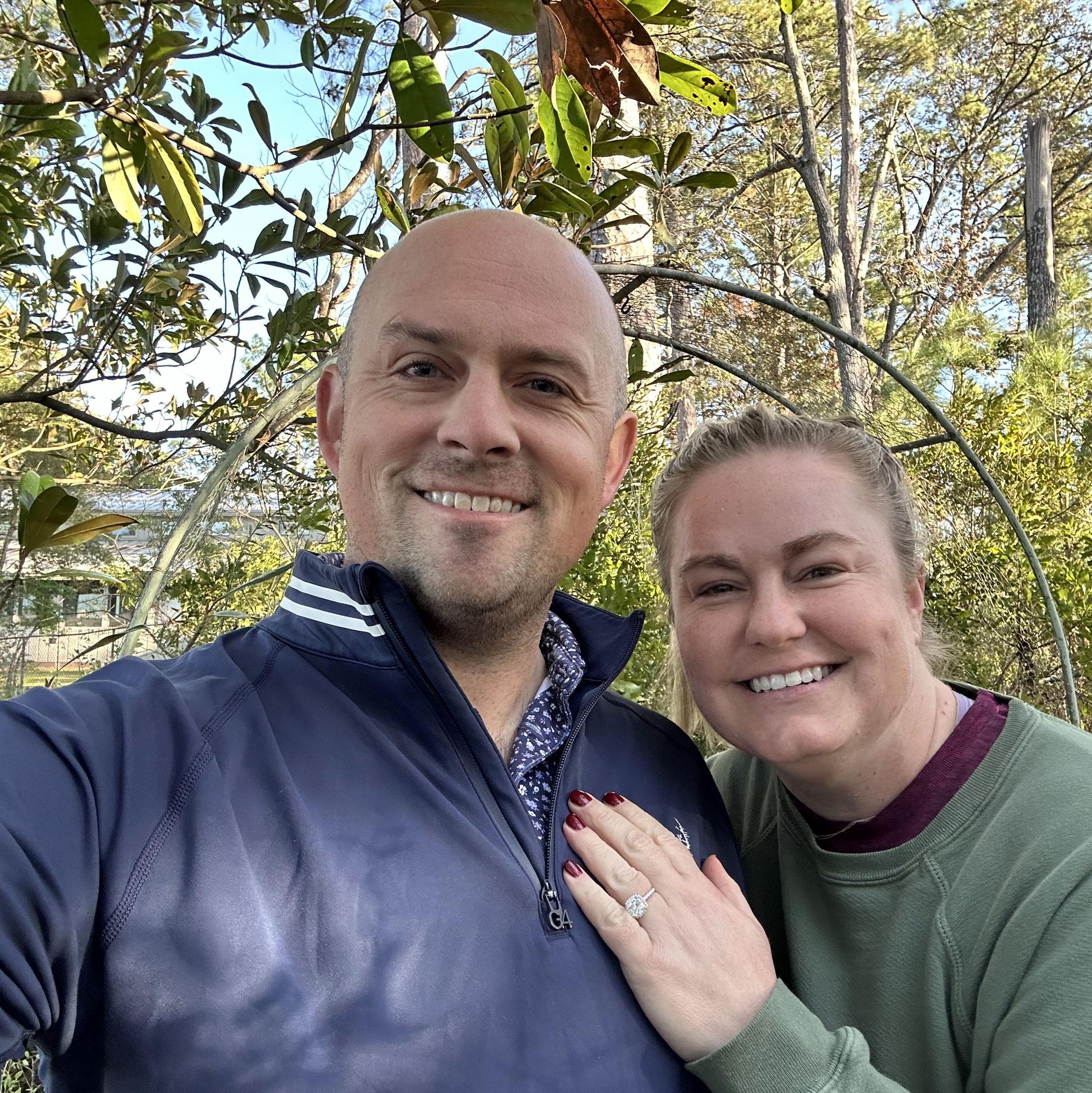 November 29, 2024 - The day after we got engaged! The arch behind us is what Charlotte's parents got married under, and it will be at our wedding, too.