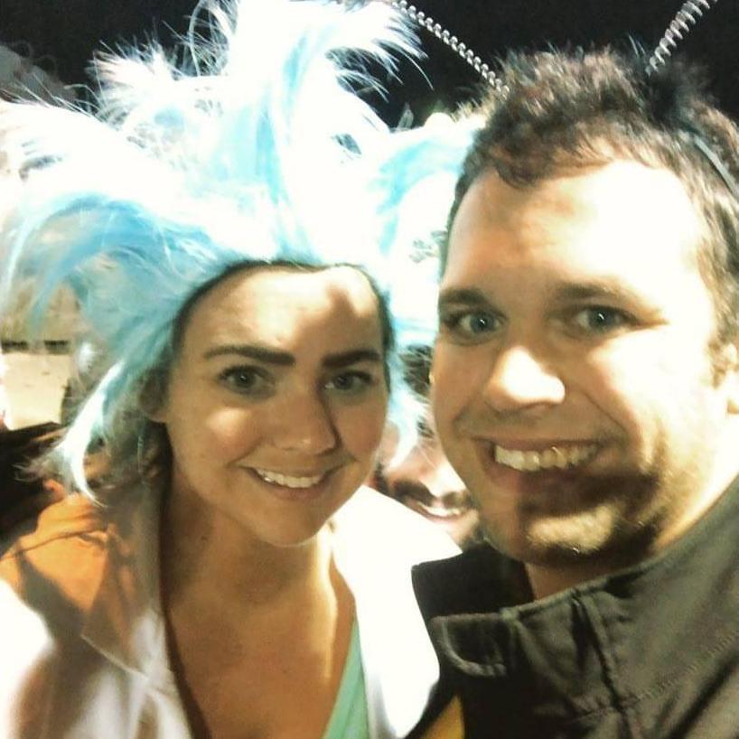 Tim and Caroline were Rick and Morty for Halloween in 2017. Caroline got really into character shooting everyone with silly string aka her portal gun.
