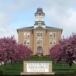 Take a picture at the Gustavus sign!