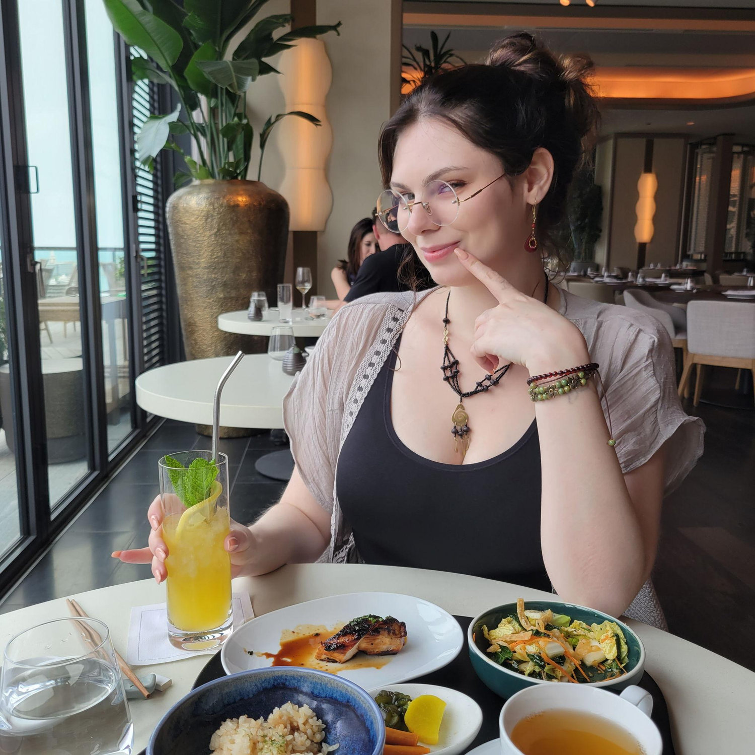 A post-flight Chicago lunch, and Olivia is feeling a little coy.