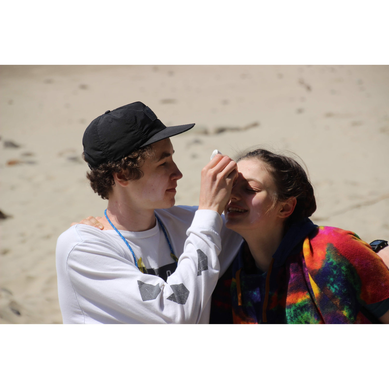 Nothing says true love like putting sunscreen on eachother.