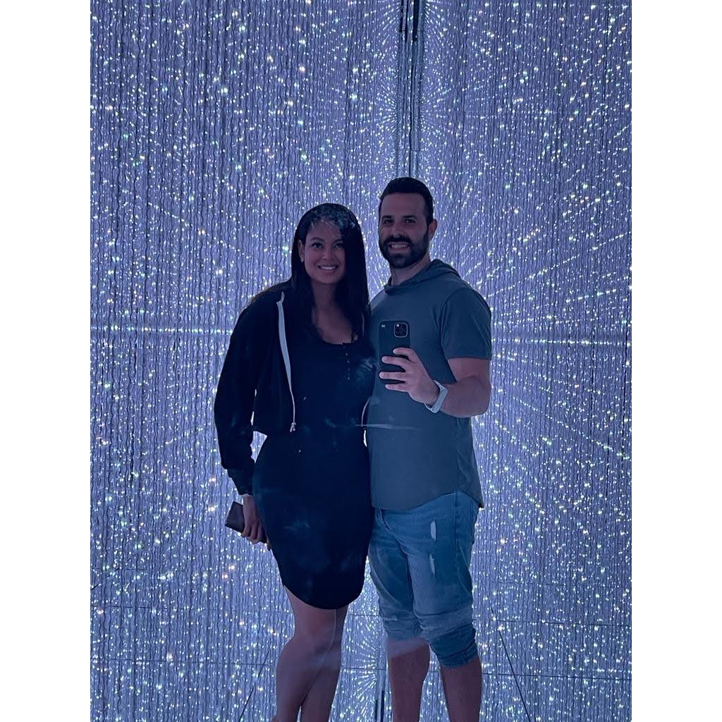 Together in the "Infinite Crystal Universe at teamLab Planets in Tokyo, Japan.