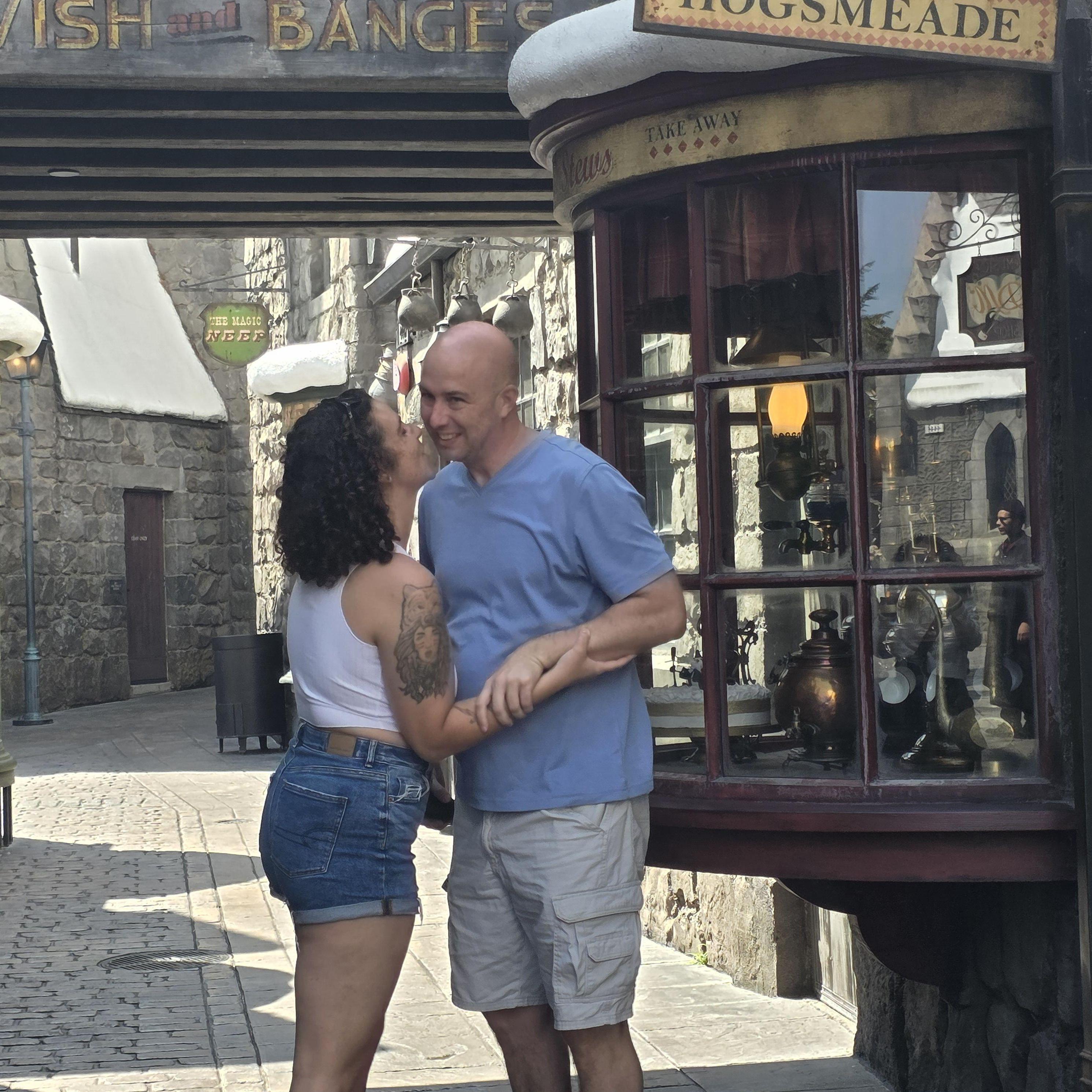 Us after Chris "proposed to me" in Harry Potter part of Universal Studios Hollywood. (We were already engaged, he thought it would be fun, I don't like that kind of attention so I made him do it in the alley lol)