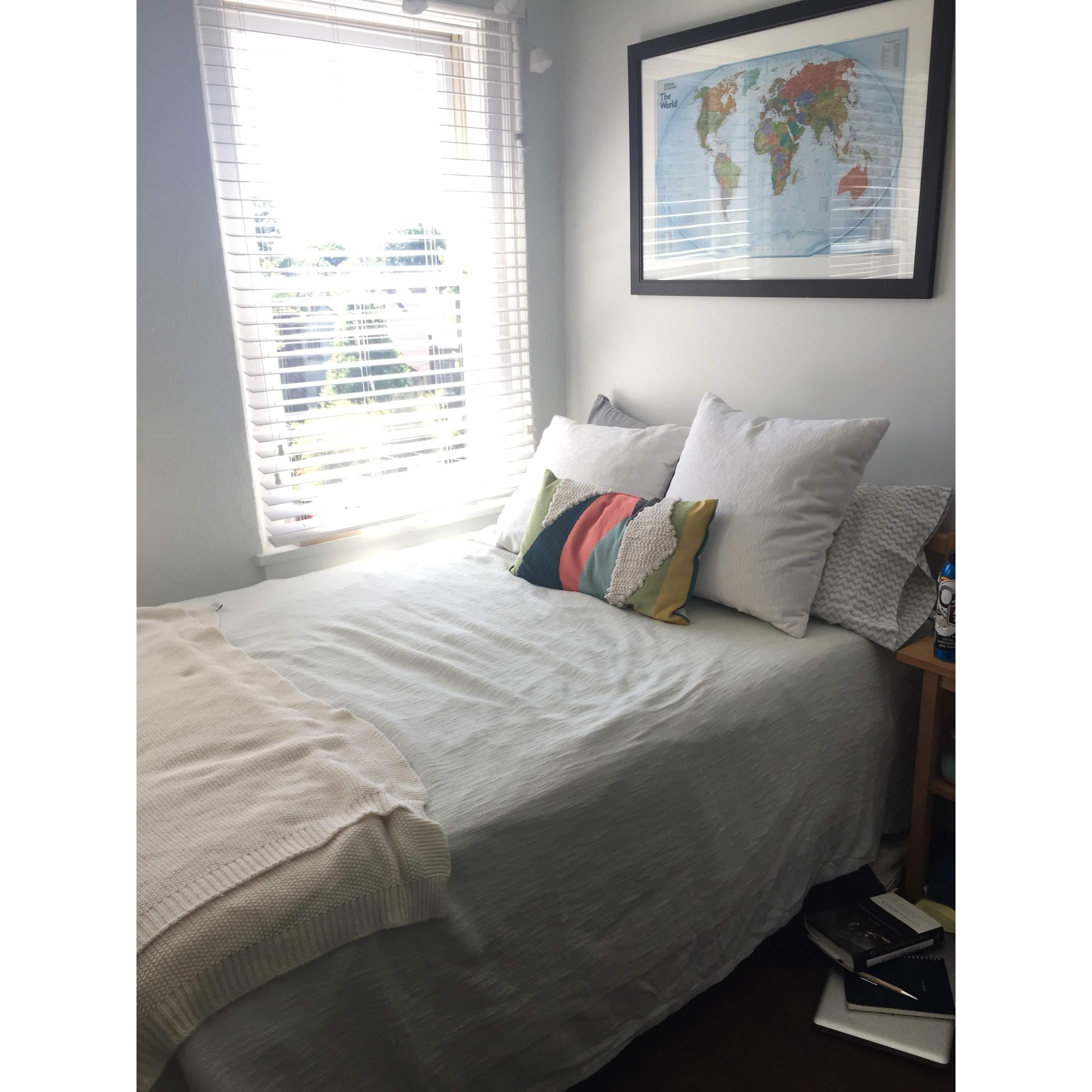 Our tiny room in our first tiny apartment that we shared with two other roommates.