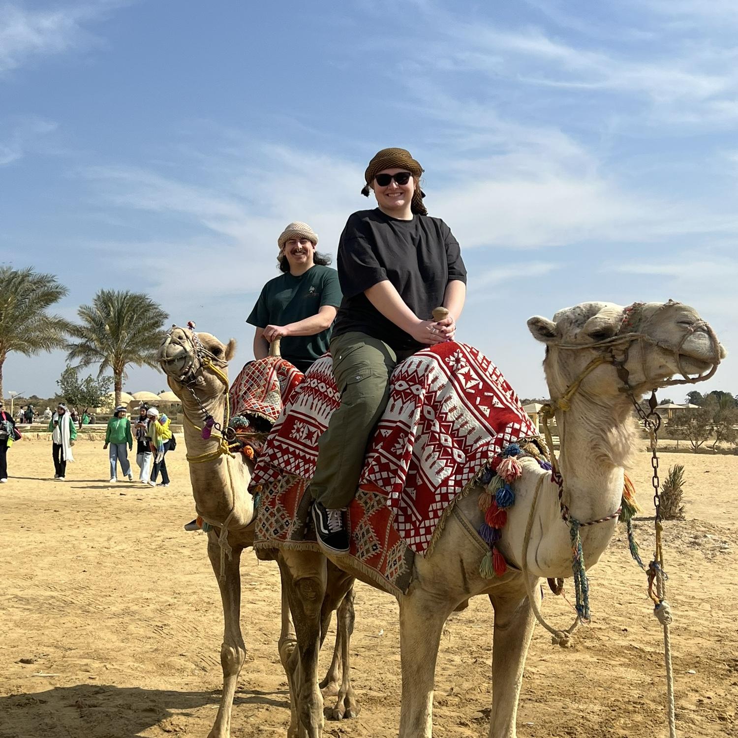 Riding camels in Wadi El Rayan National Park in Egypt.