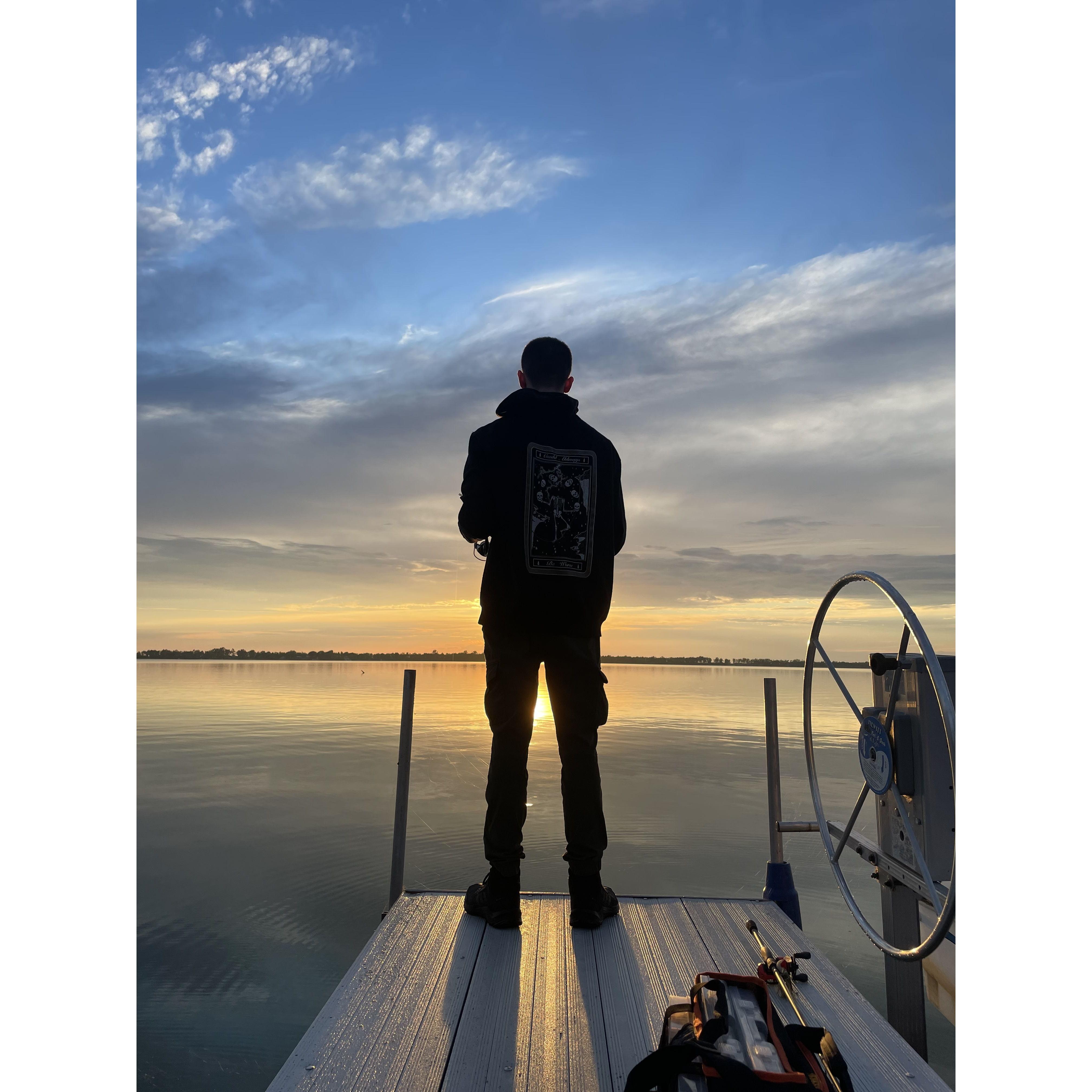 Ryan fishing off of our dock in North Sandy Pond
