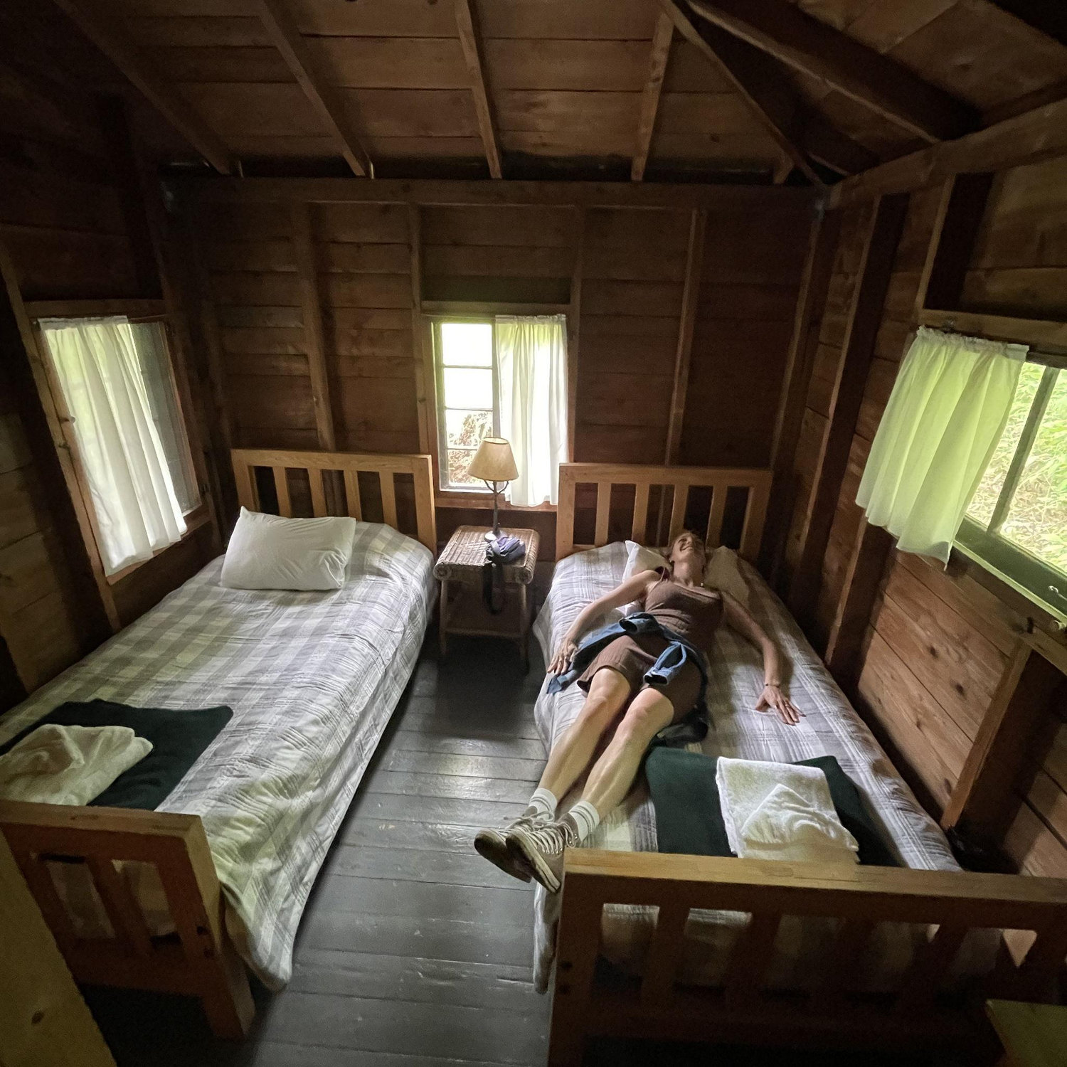 Beds with linens, pillows, wool blankets, and towels. Emily wouldn't be caught dead with shoes on the bed.