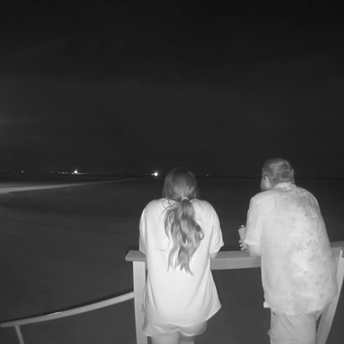 One of my favorite pictures of us! On our front porch, watching our neighbors harvesting.