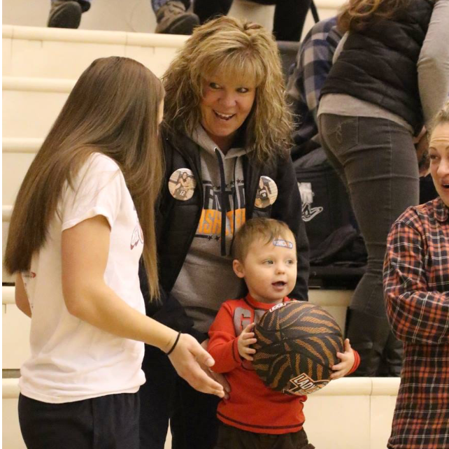 Paxton getting a basketball at a JHHS basketball game
