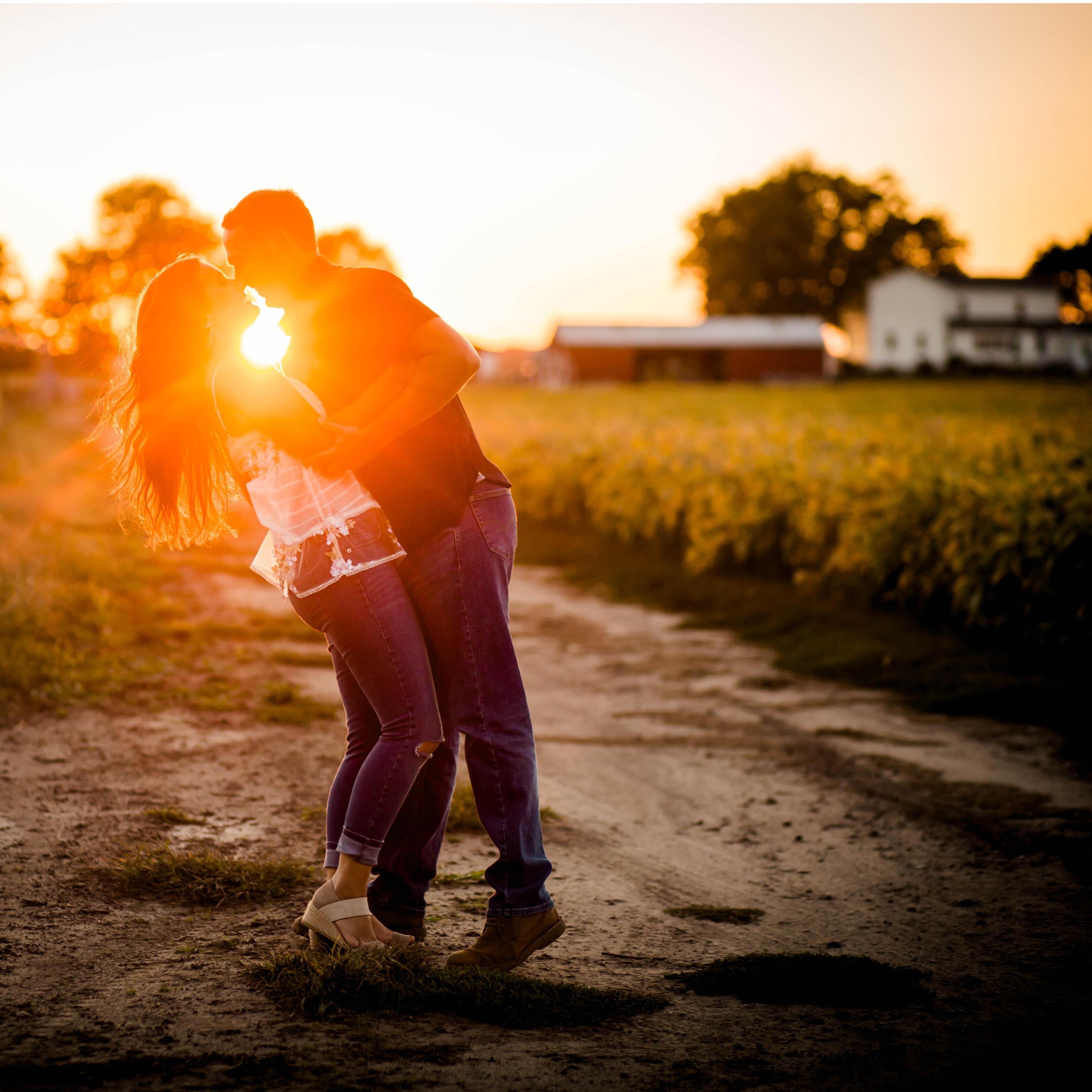 When the photography asked us where we wanted most of our engagement photos, we replied, "I don't know, just around a farm?" She took that idea and made this amazing photo!