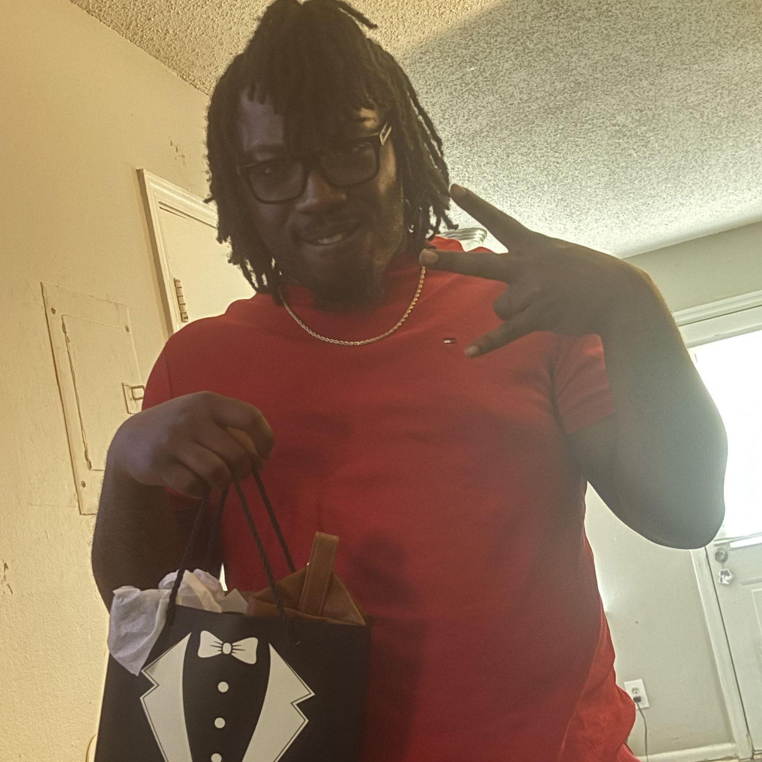 Kaleob accepting his groomsman box!