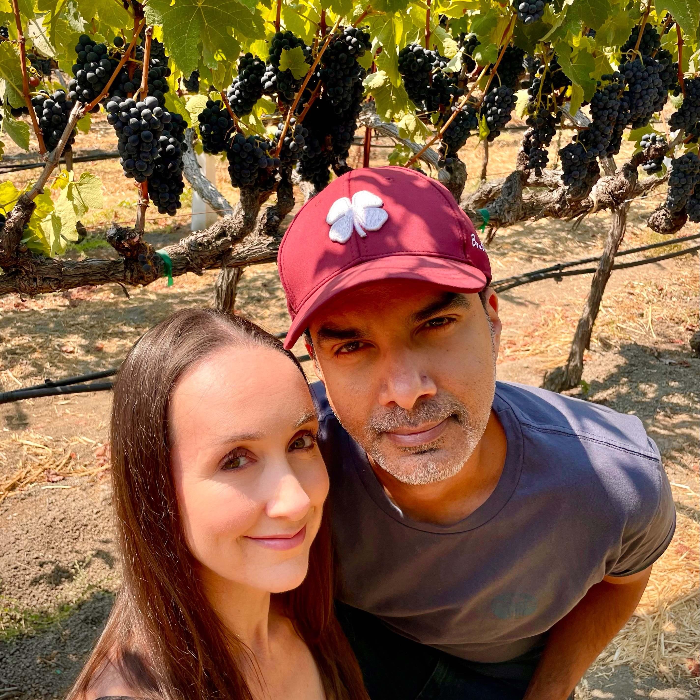 "taking photos in the vineyard" (sneaking grapes!)
