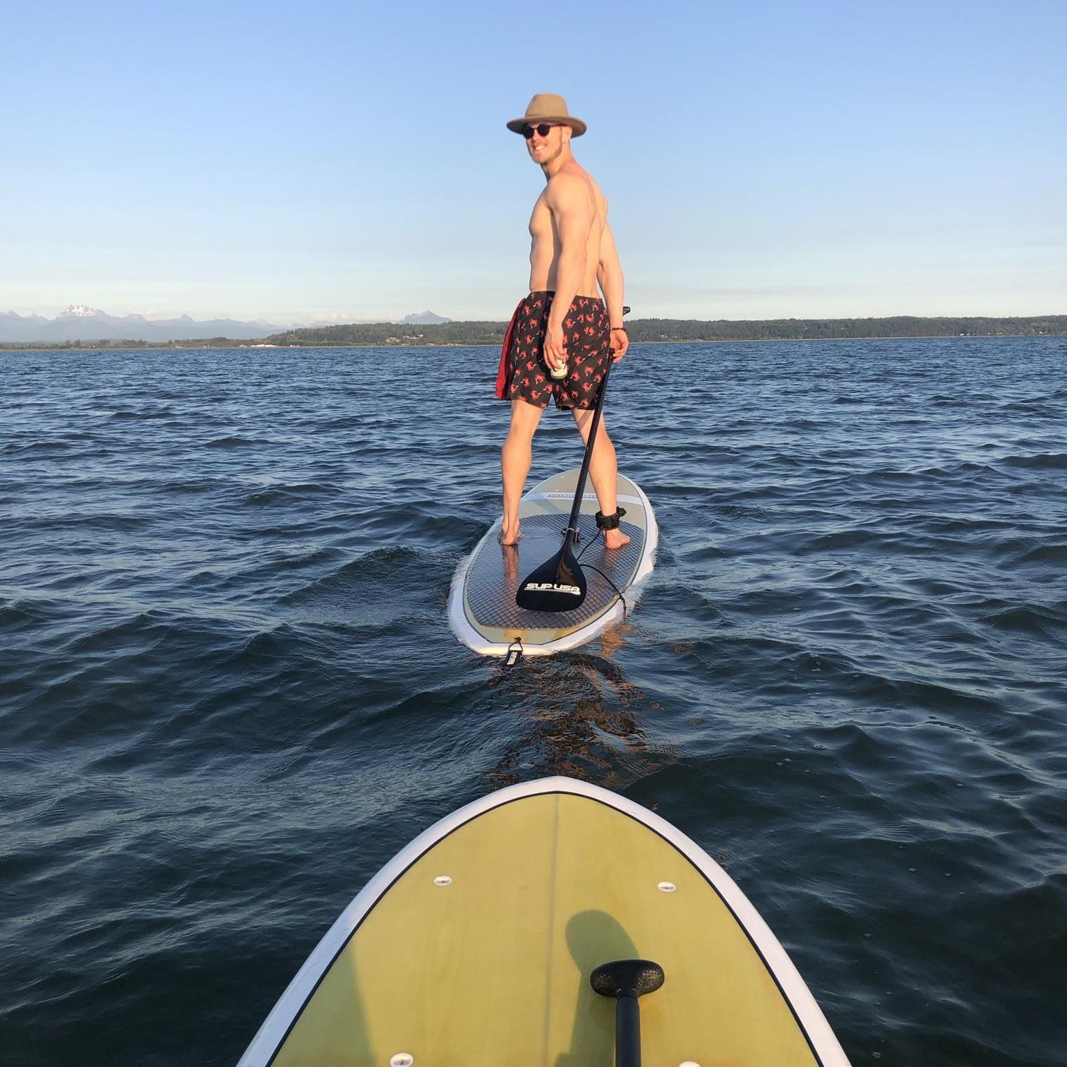 Tommy & Tina paddle boarding at Juniper Beach on Camano Island
