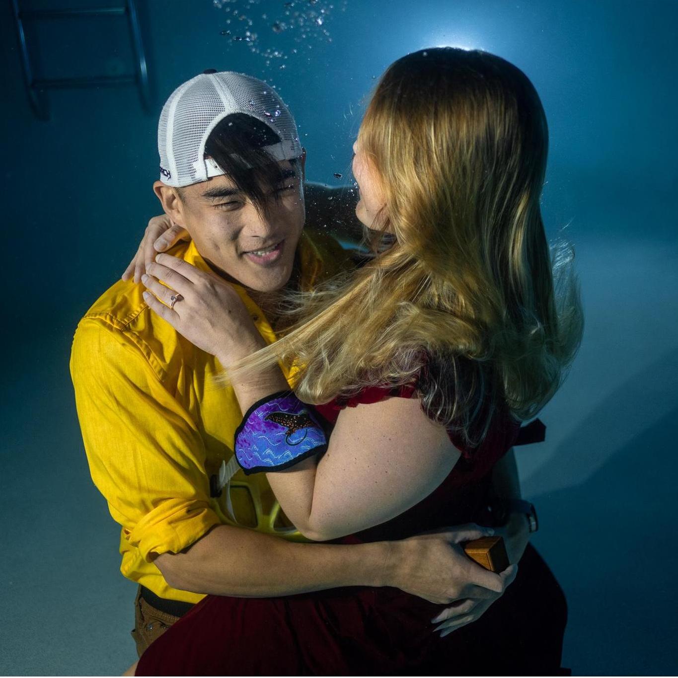 Lindsay accepting Andrew's proposal underwater.