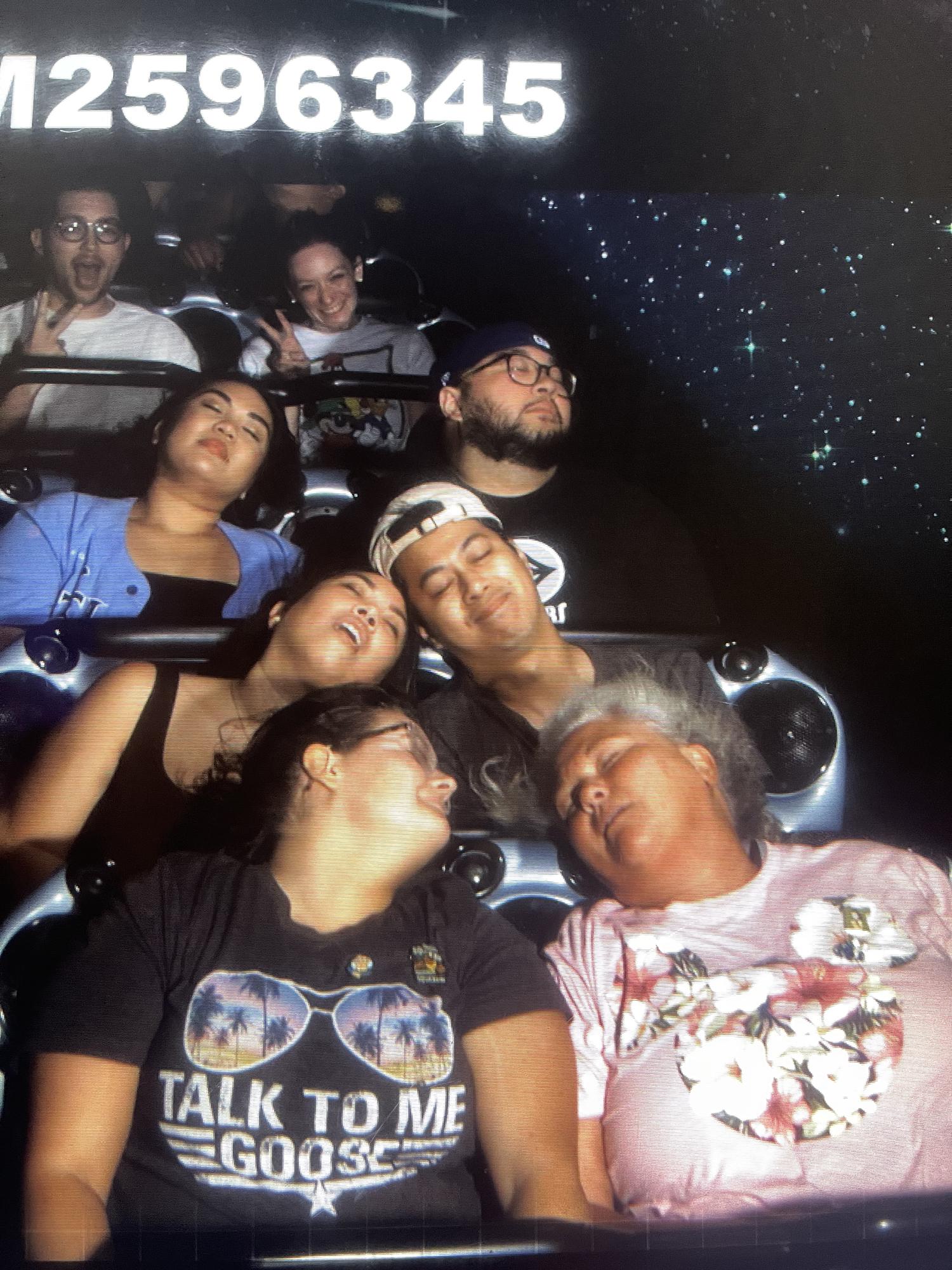 Posing on Space Mountain with Nikko, Des, and two strangers, 2022