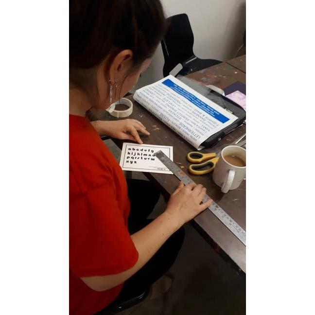 Carefully lining everything up on the wedding invitations!