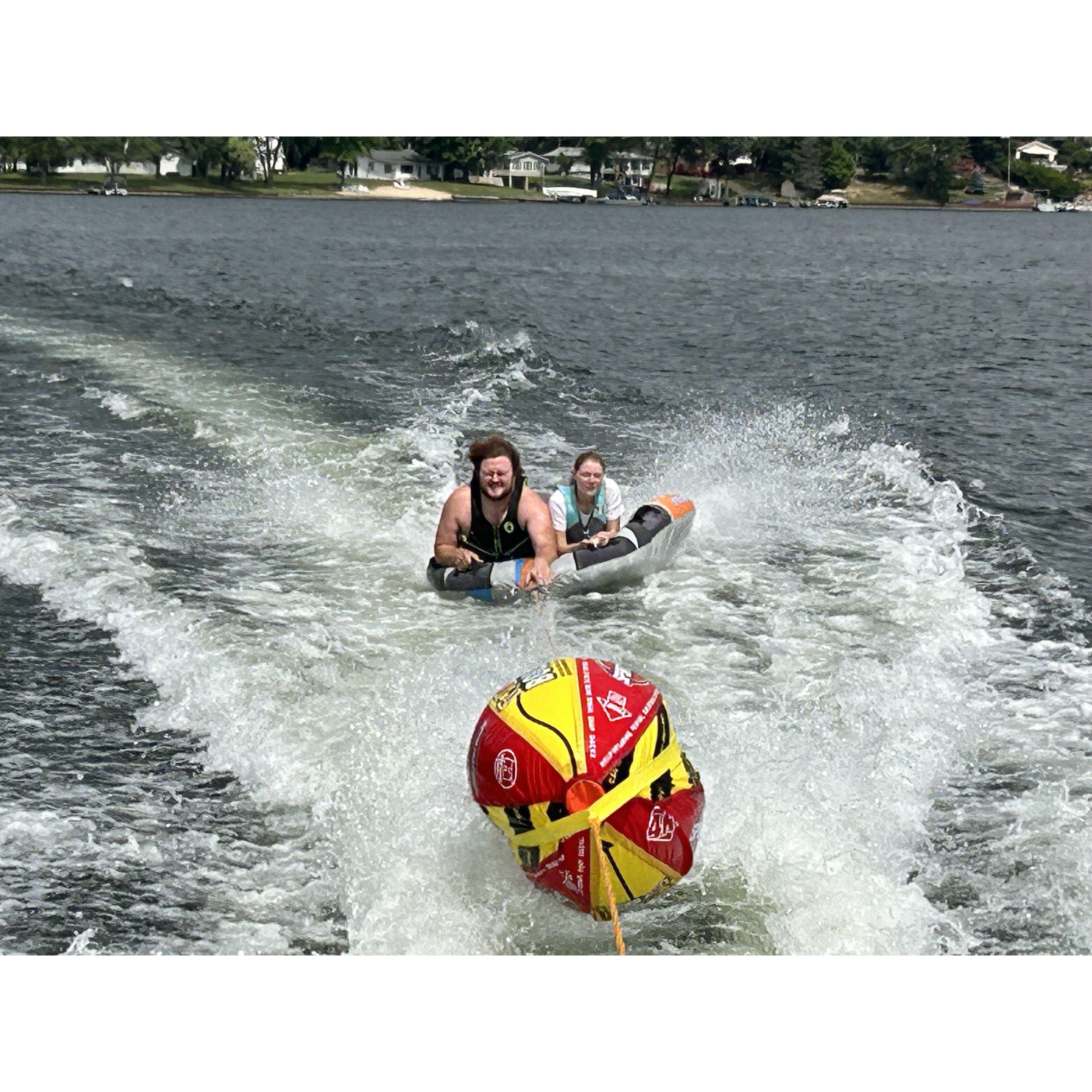 Nathan and Morgan tubing on Lake Ogemaw 2023.
