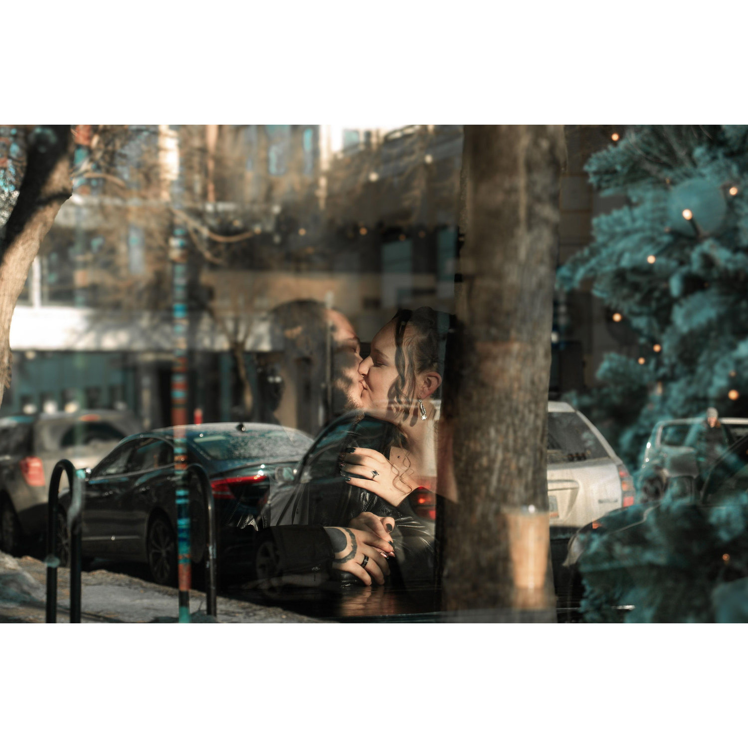 Taken from outside the window at our favorite coffee spot (Engagement shoot)