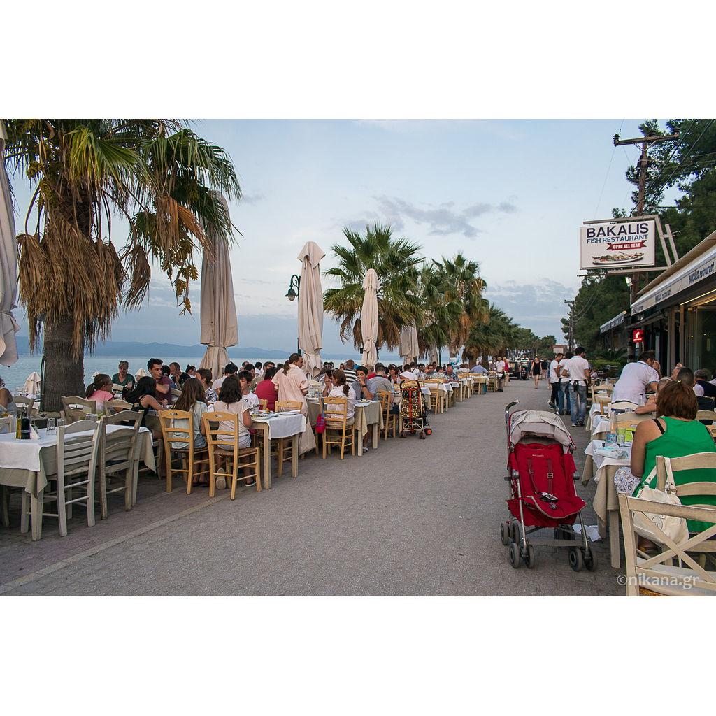 Main strip in Pefkochori with restaurants on the water, usually only for pedestrians