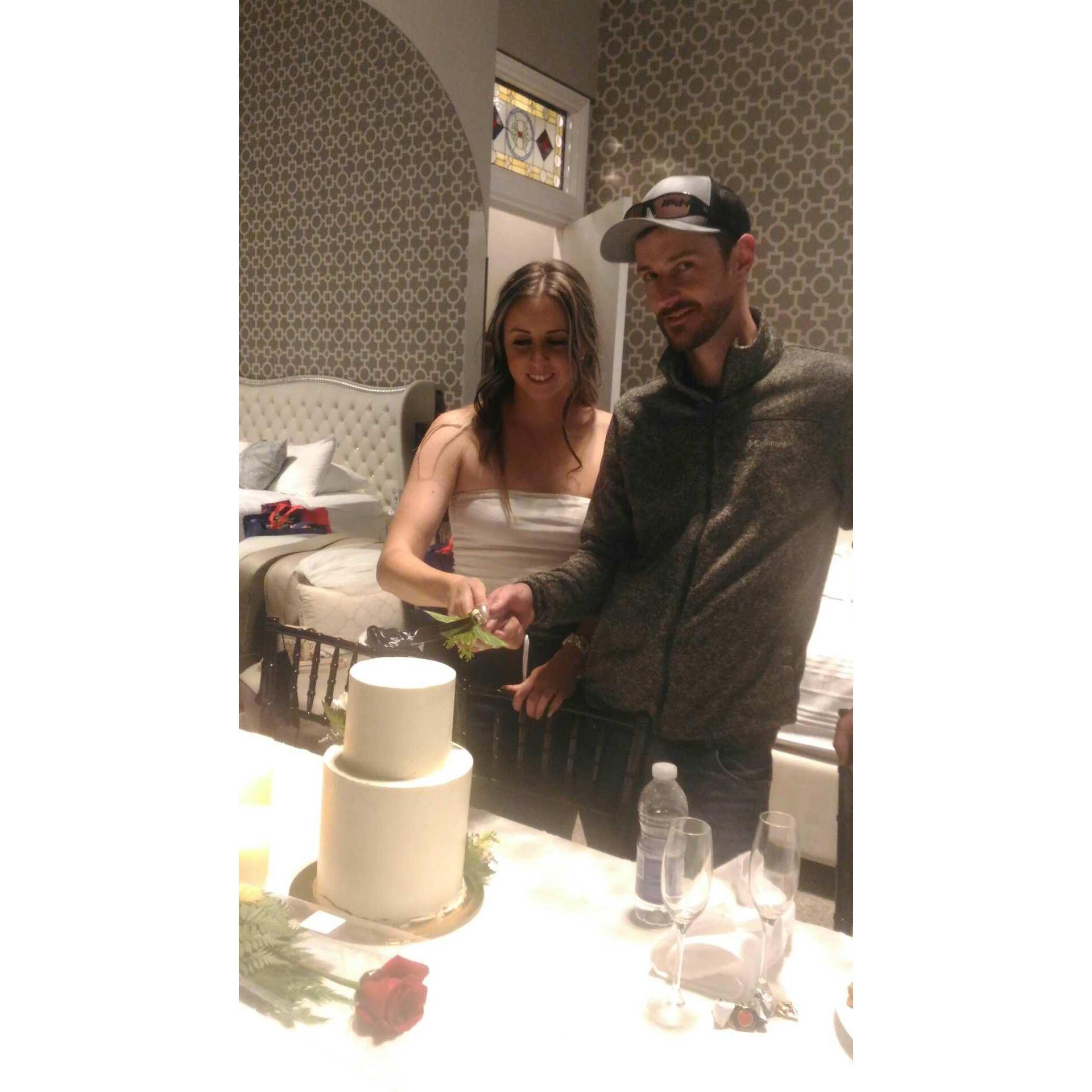 Cutting the cake, later in the night, with the Deschamps Family cake knife! Our names to be engraved next !