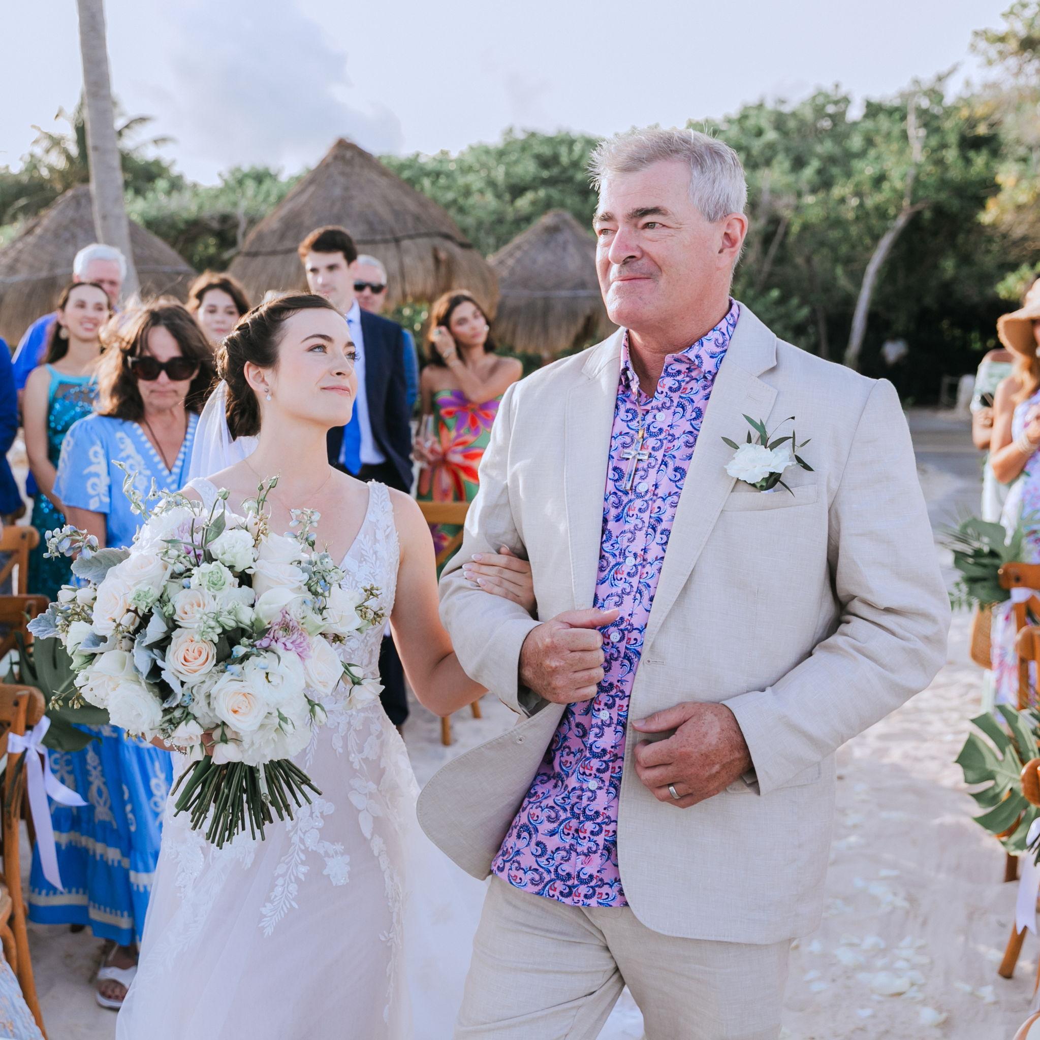 Katie's dad walked her down the aisle to a slow instrumental cover of Concerning Hobbits.
