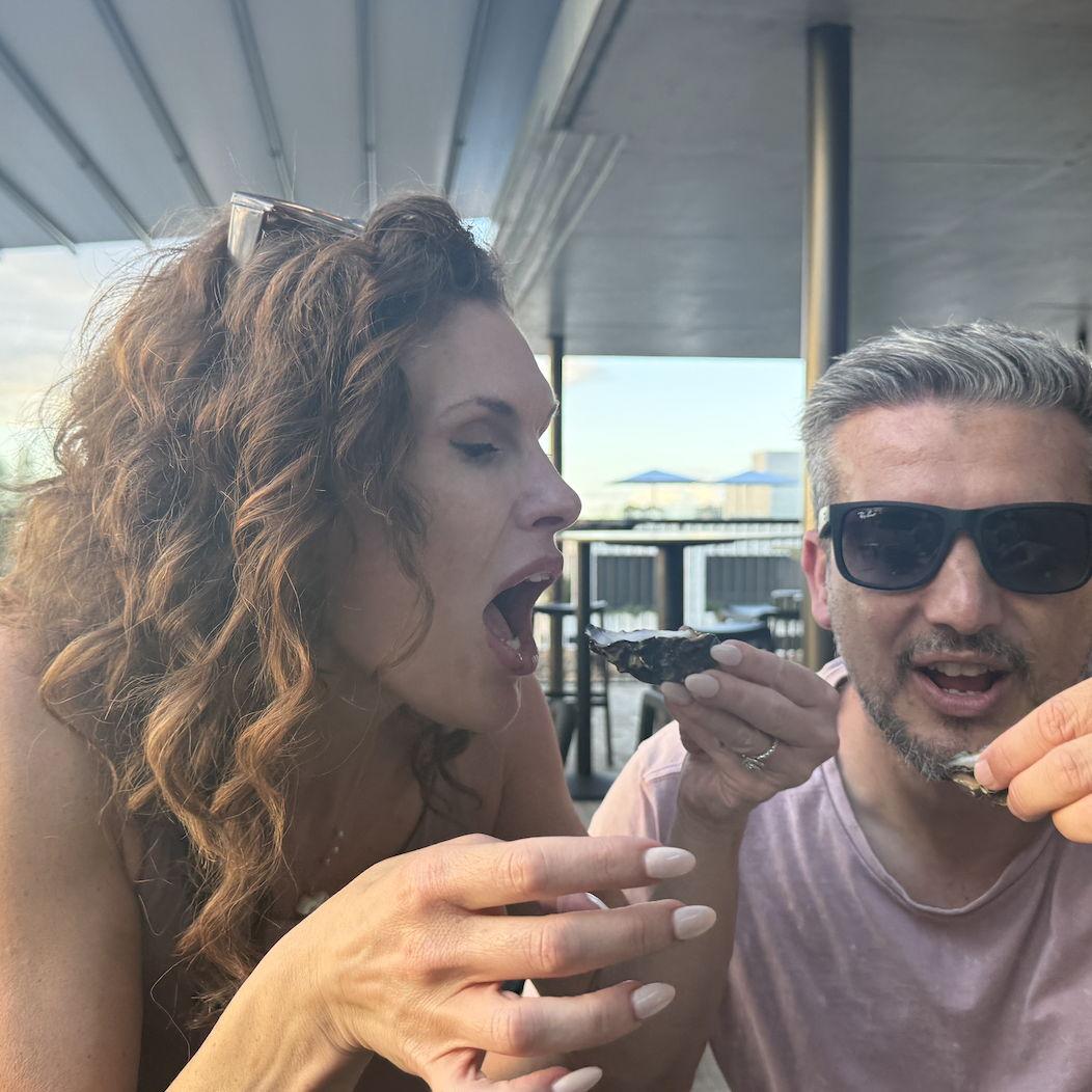 Having an oyster cheers in Byron Bay