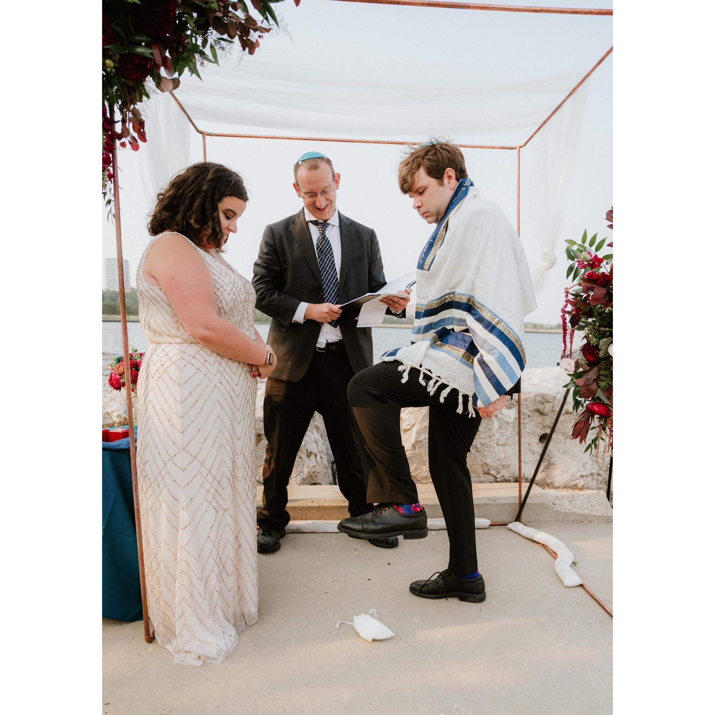 Zach breaks the glass.
Margaret and Zach put the broken glass in their mezuzah, which they have hanging in the doorway of their home.
Ceremony, Lake Michigan, Milwaukee, WI