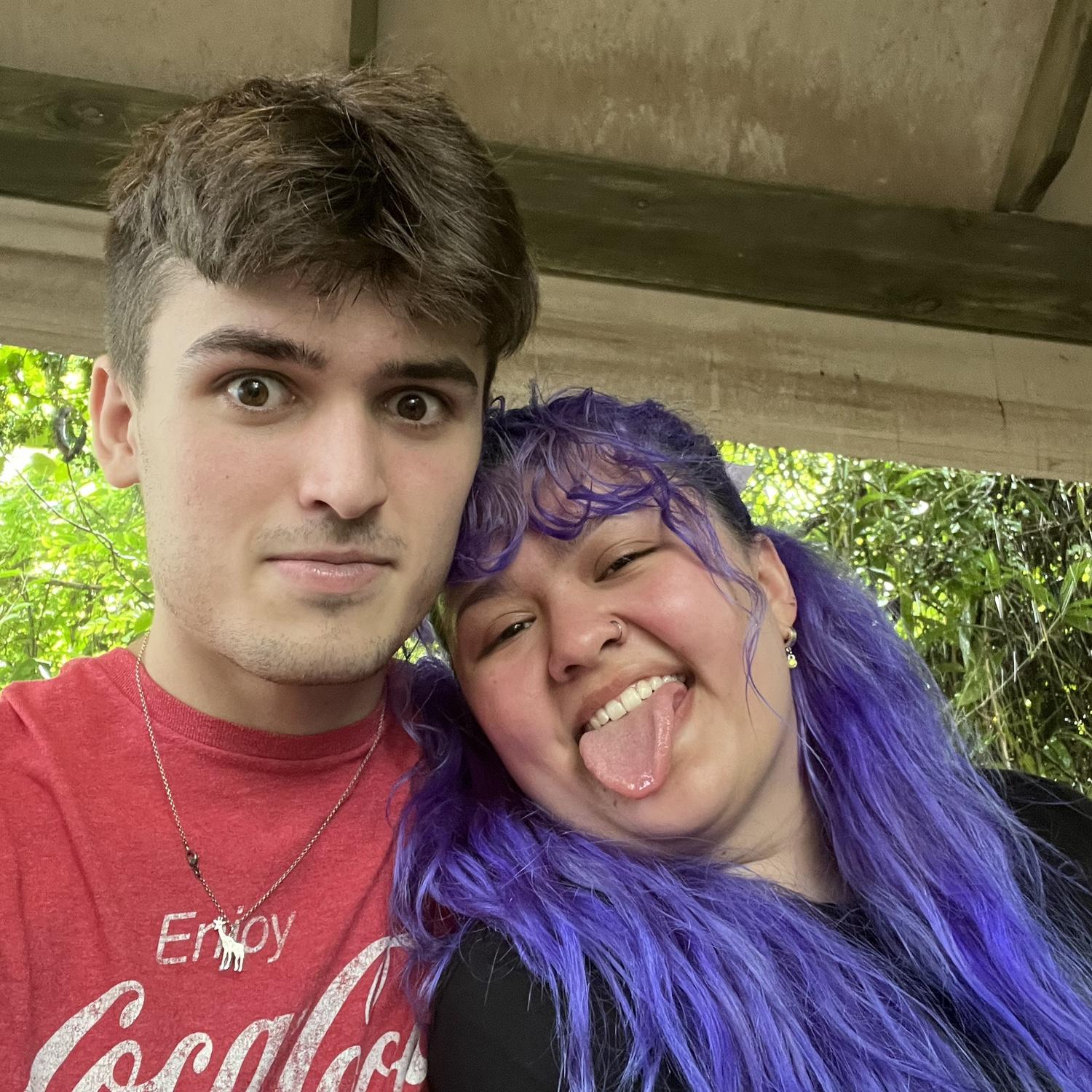 It kept raining at Busch gardens causing all the rides to stop so we just chilled under a display roof