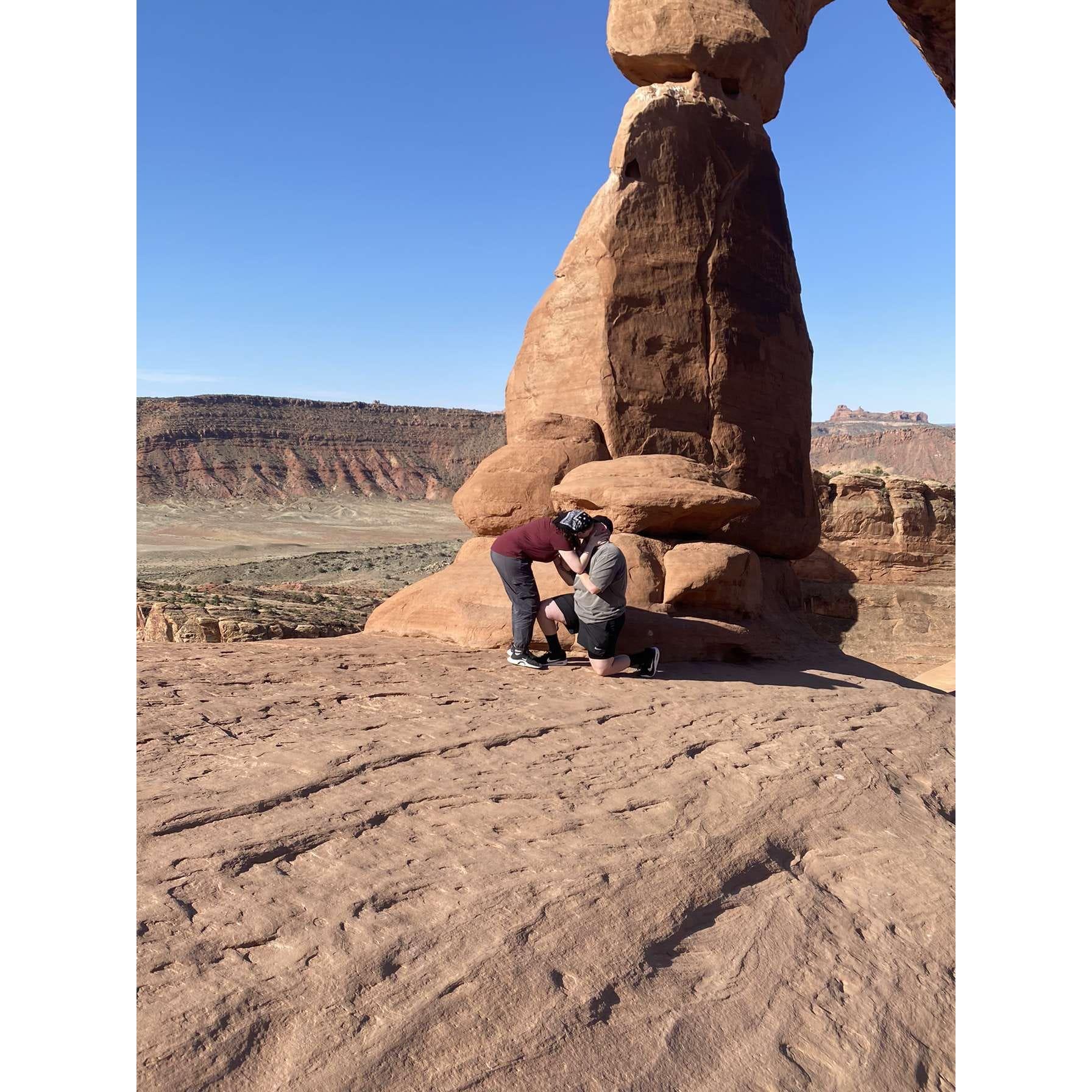 Engagement pic in front of delicate arch