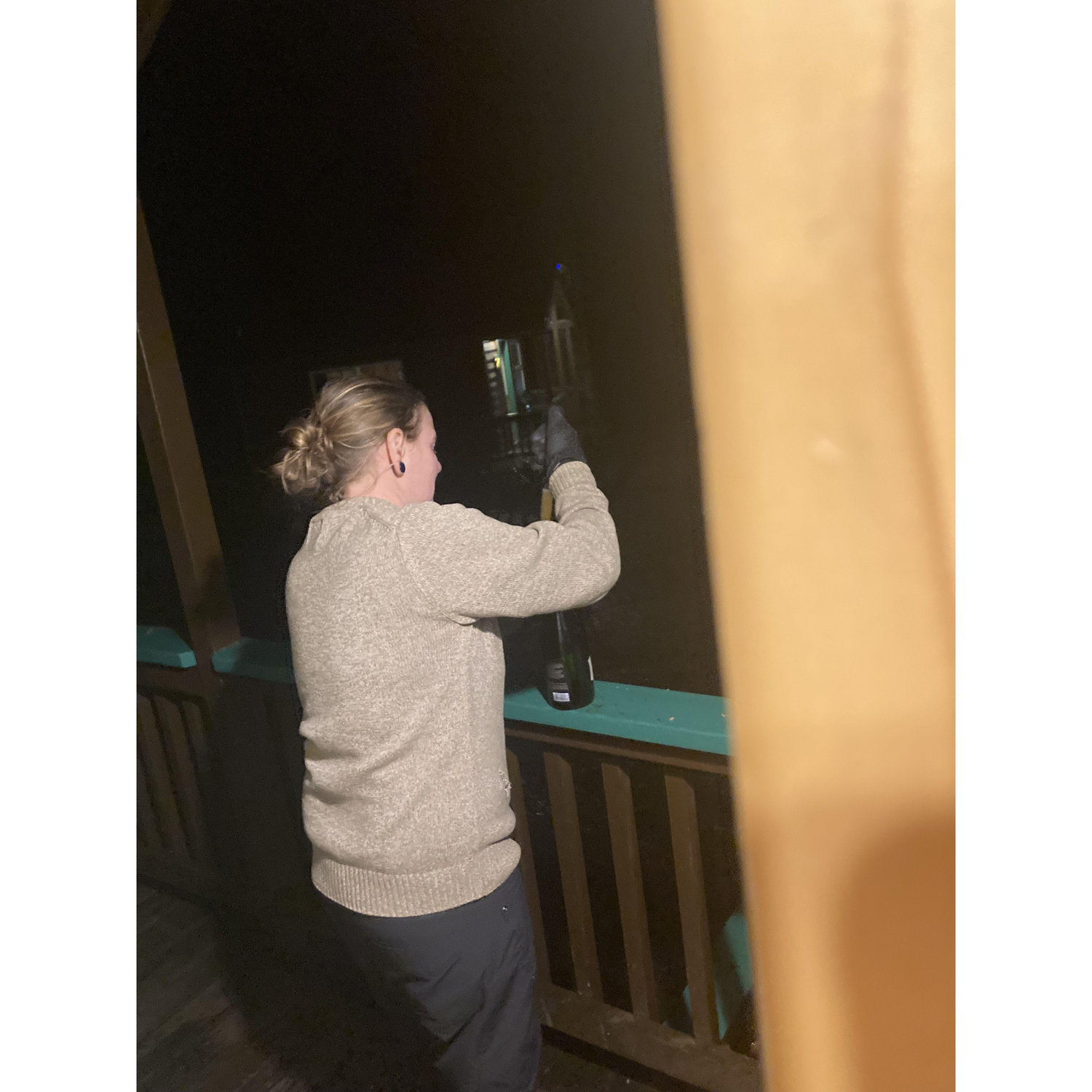 Trying to get the damn Champagne bottle open after the proposal!!
