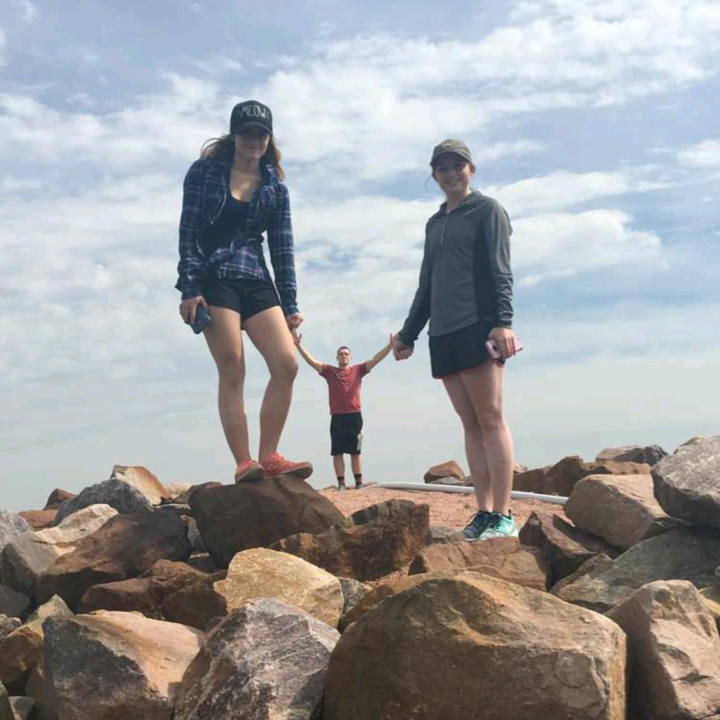 Kimberly and Cheyenne "holding" miniature Bob's hands at Yankton.