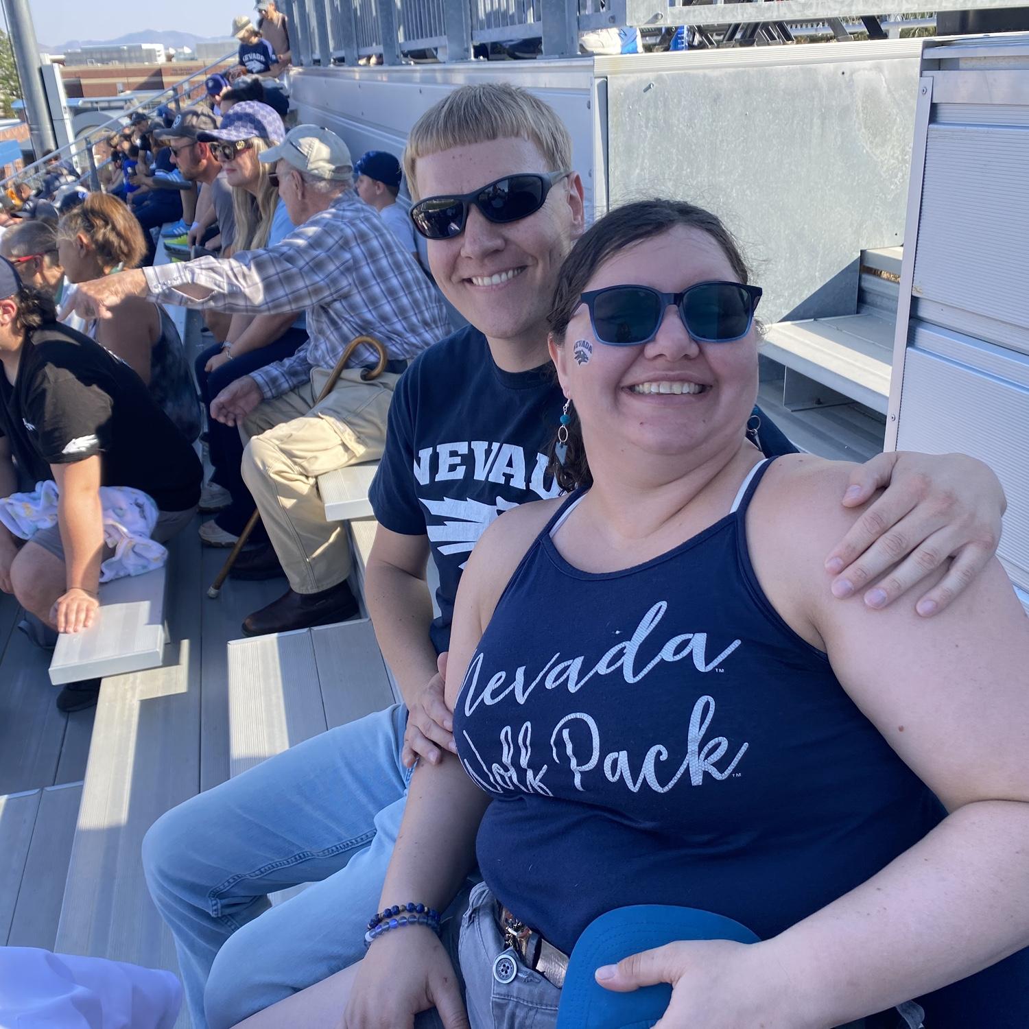 Kevin dragging Taylor to a UNR football game.